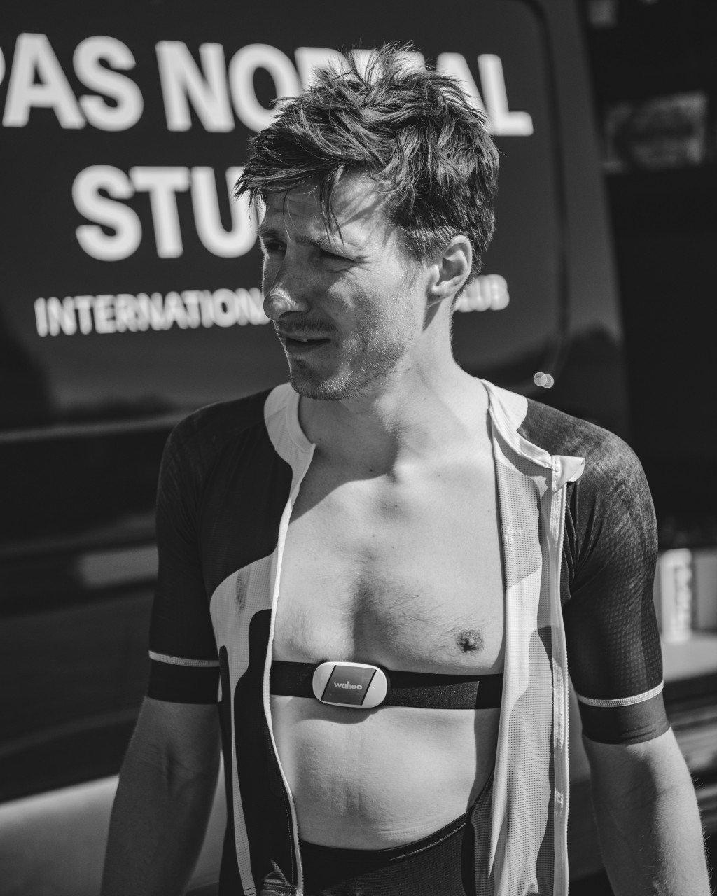Cyclist wearing heart rate monitor and arm warmers in black and white portrait
