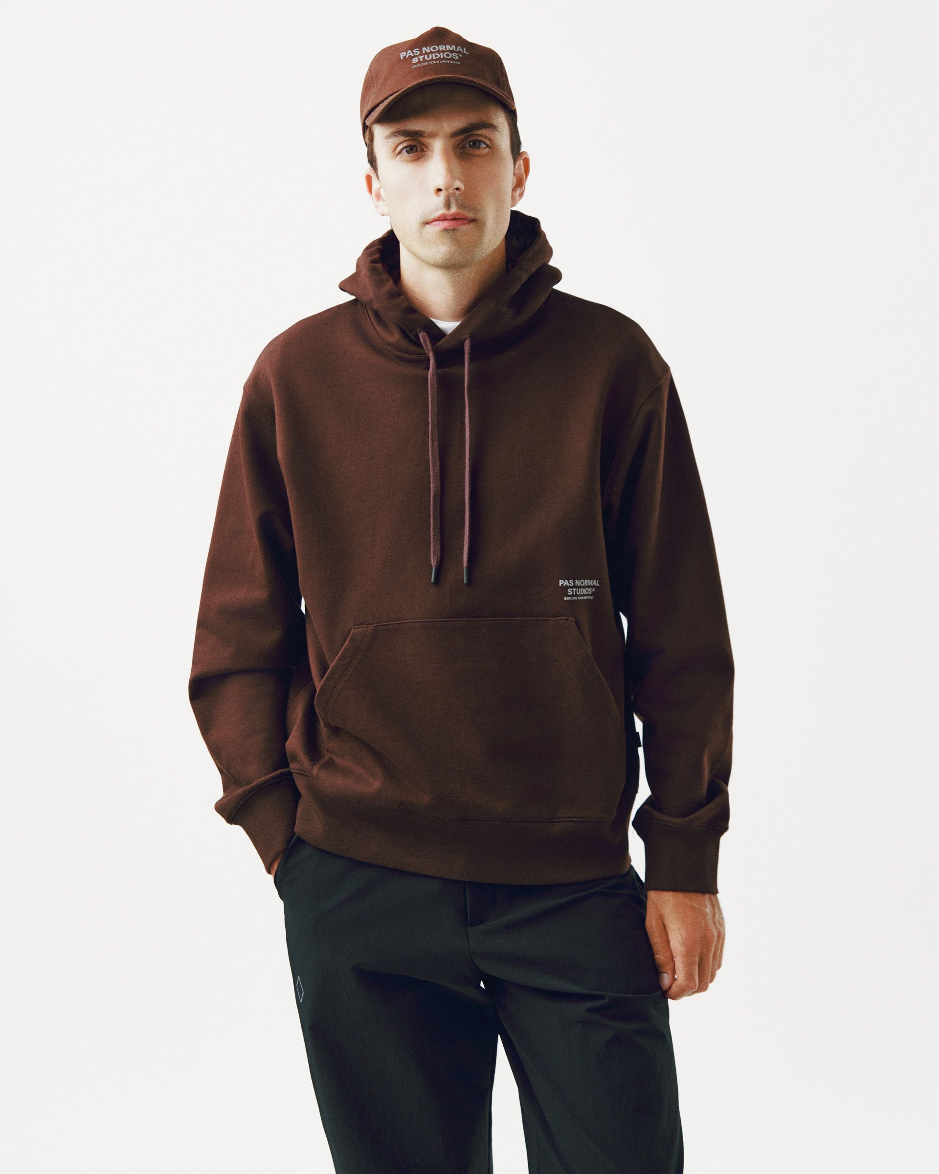 Light Brown Off-Race hoodie on model with kangaroo pocket and drawstring hood