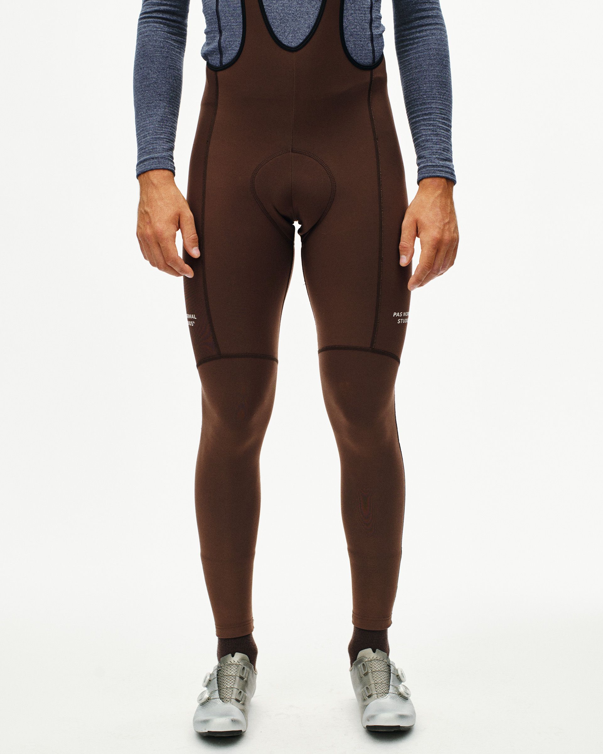 Light Brown Essential Thermal Long cycling bibs on model, front view with chamois pad and leg warmers