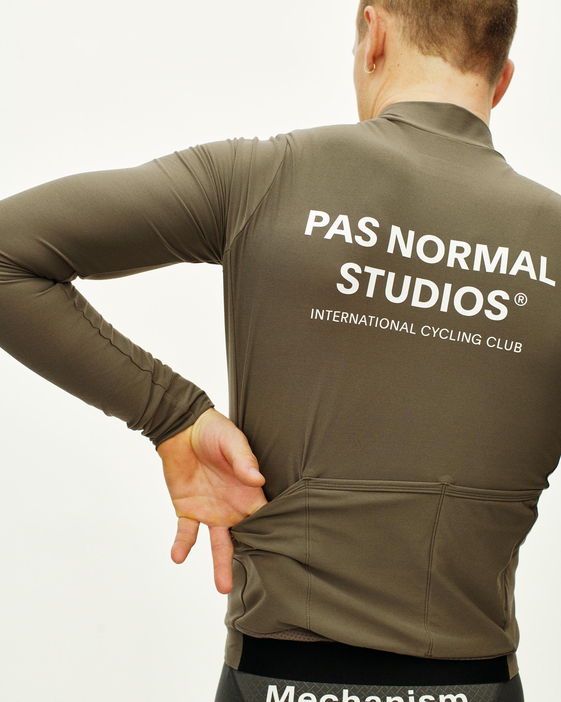 Mud Mechanism long sleeve cycling jersey on model, rear view with white back print