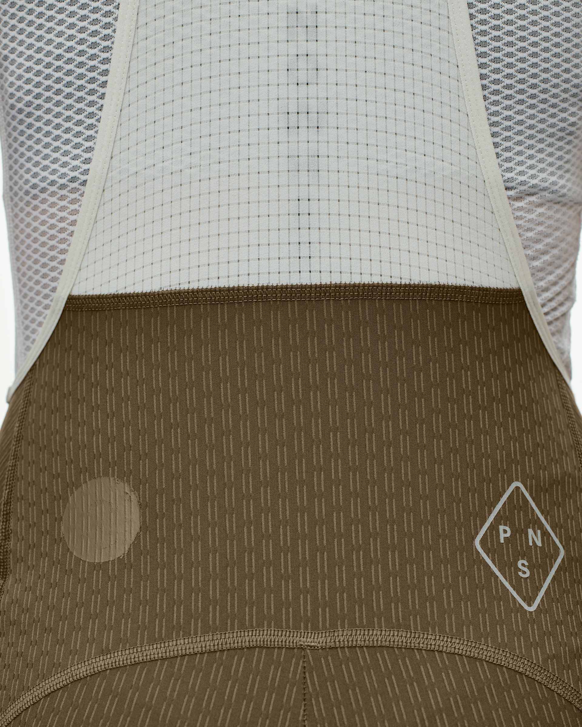 Dark Stone T.K.O. Essential Light Cargo bibs, rear detail view with textured fabric and white logo