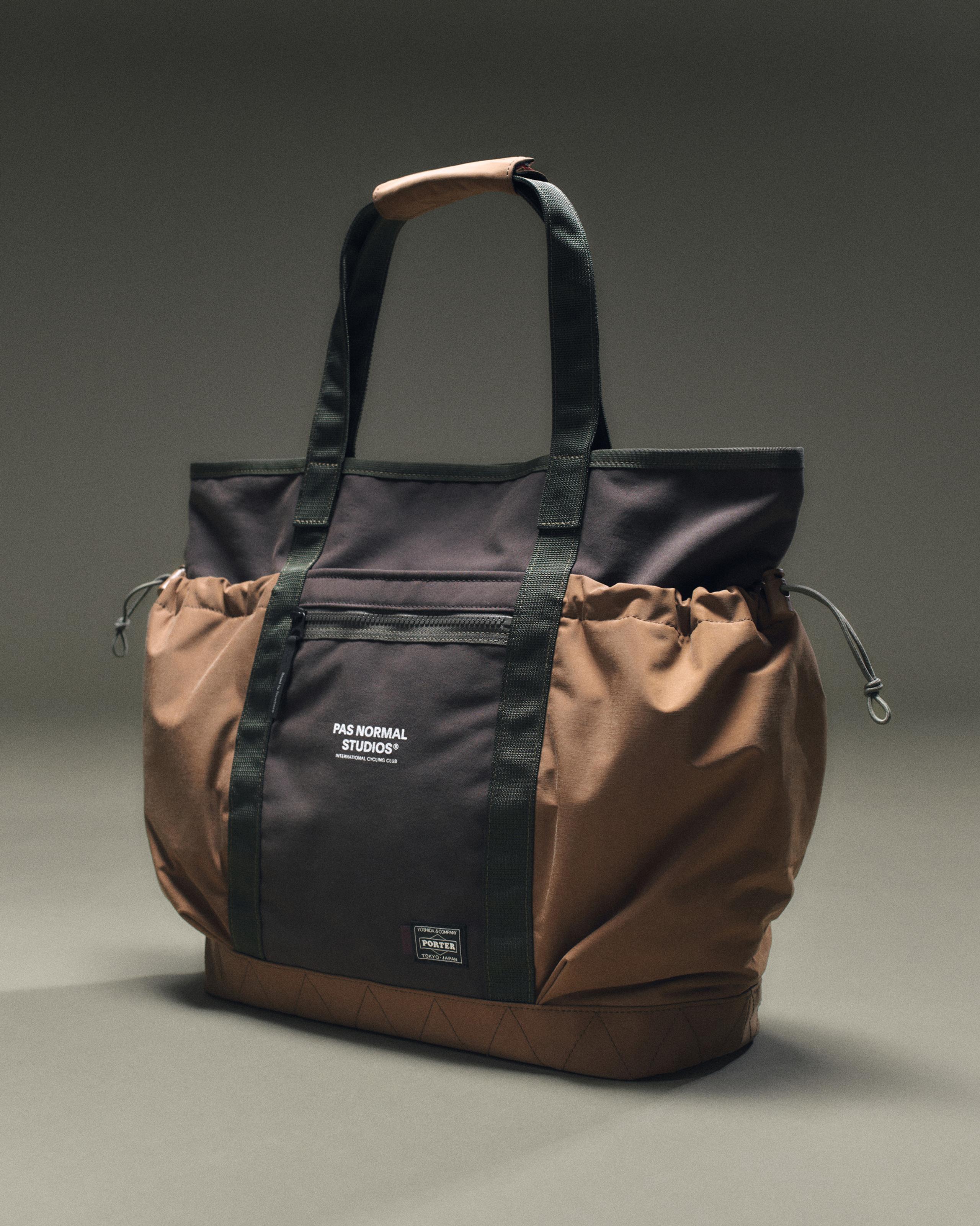 Light Brown Porter-Yoshida tote bag, three-quarter view with black front panel, drawstring sides, and tan leather handle