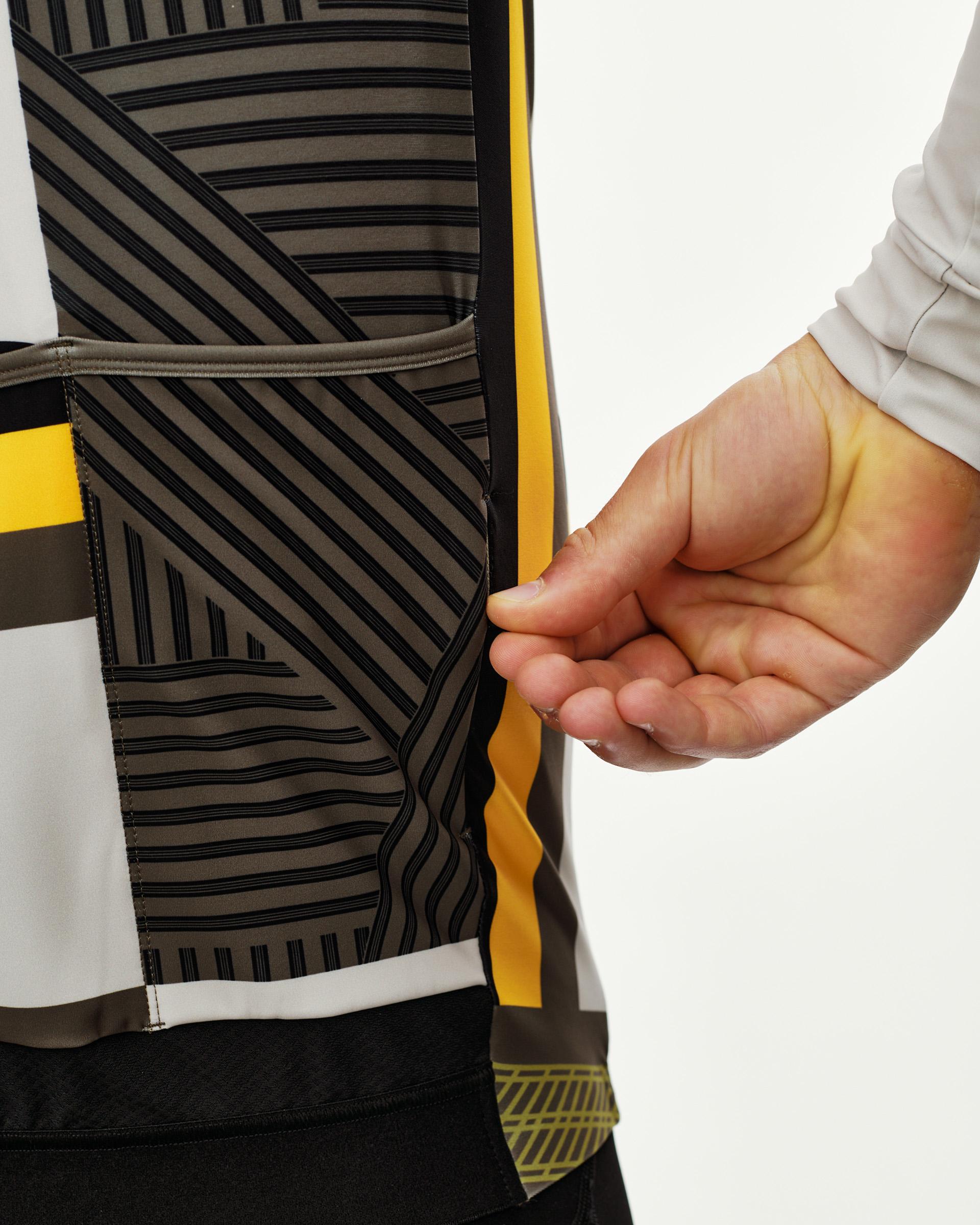 International Sand Mechanism long sleeve cycling jersey, rear detail on model showing back pocket with geometric stripe print