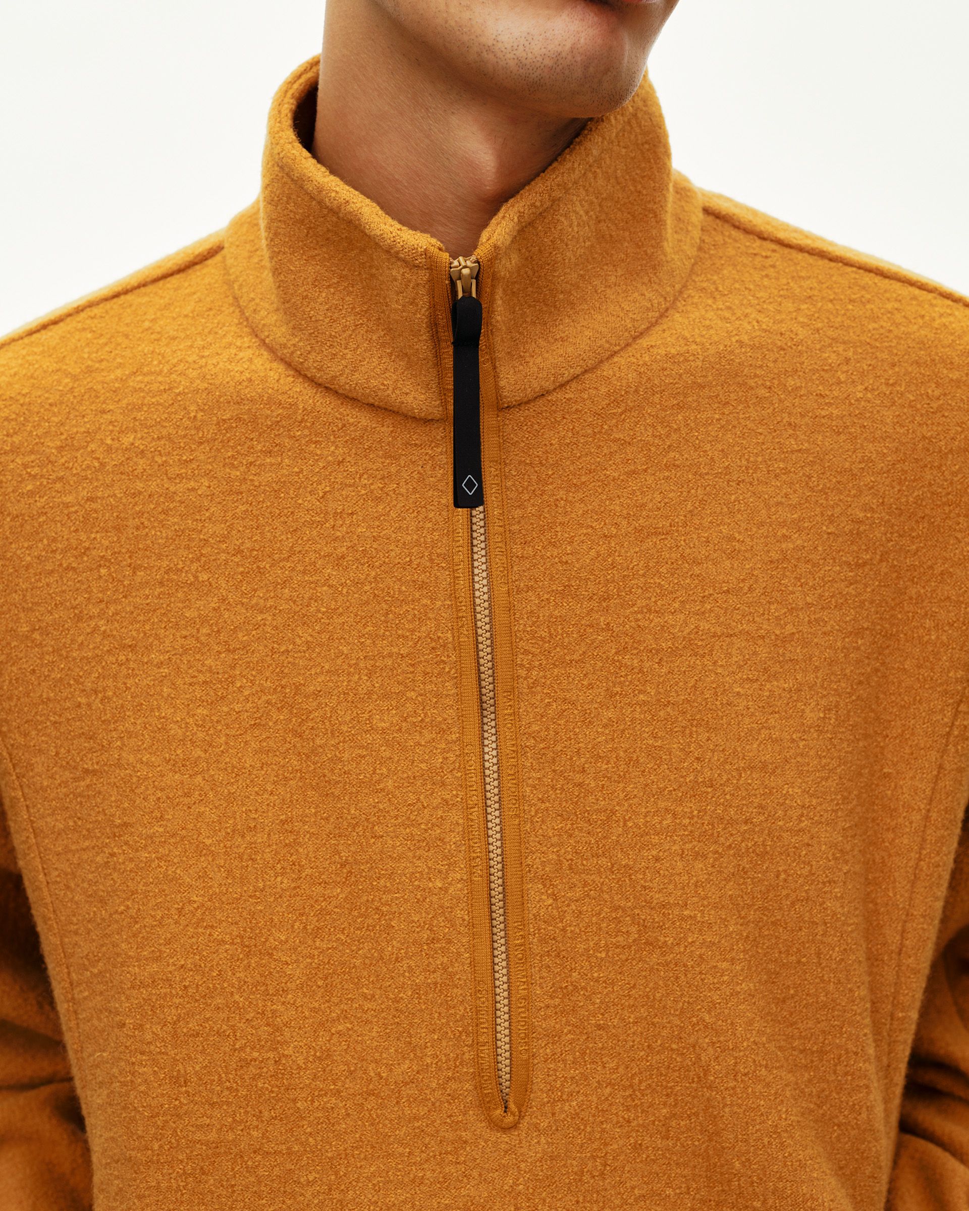 Ochre Off-Race Boiled Wool Half-Zip outerwear, front detail on model with half-zip and funnel collar