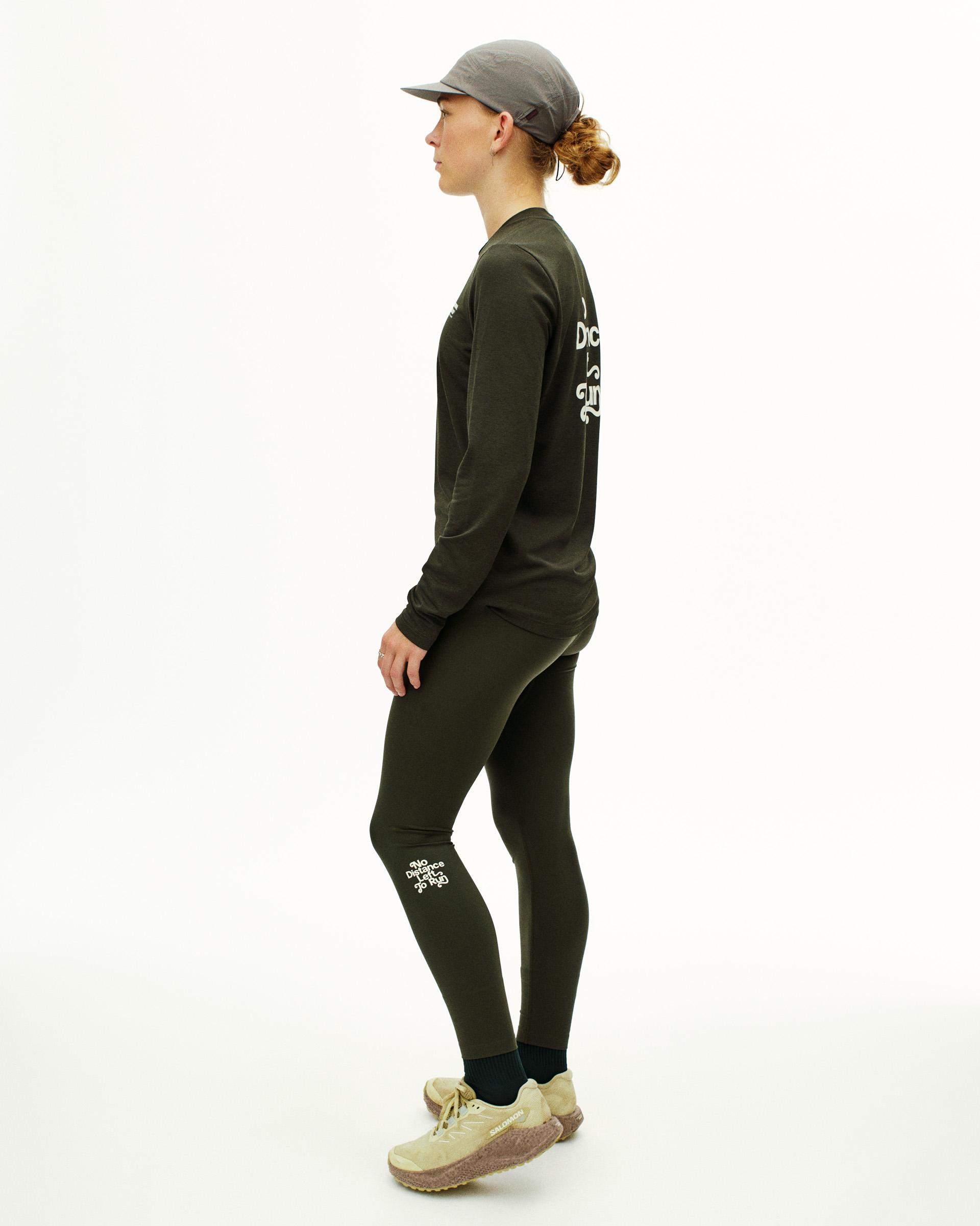 Dark Olive Balance long sleeve t-shirt on model, side view with white sleeve and leg graphics