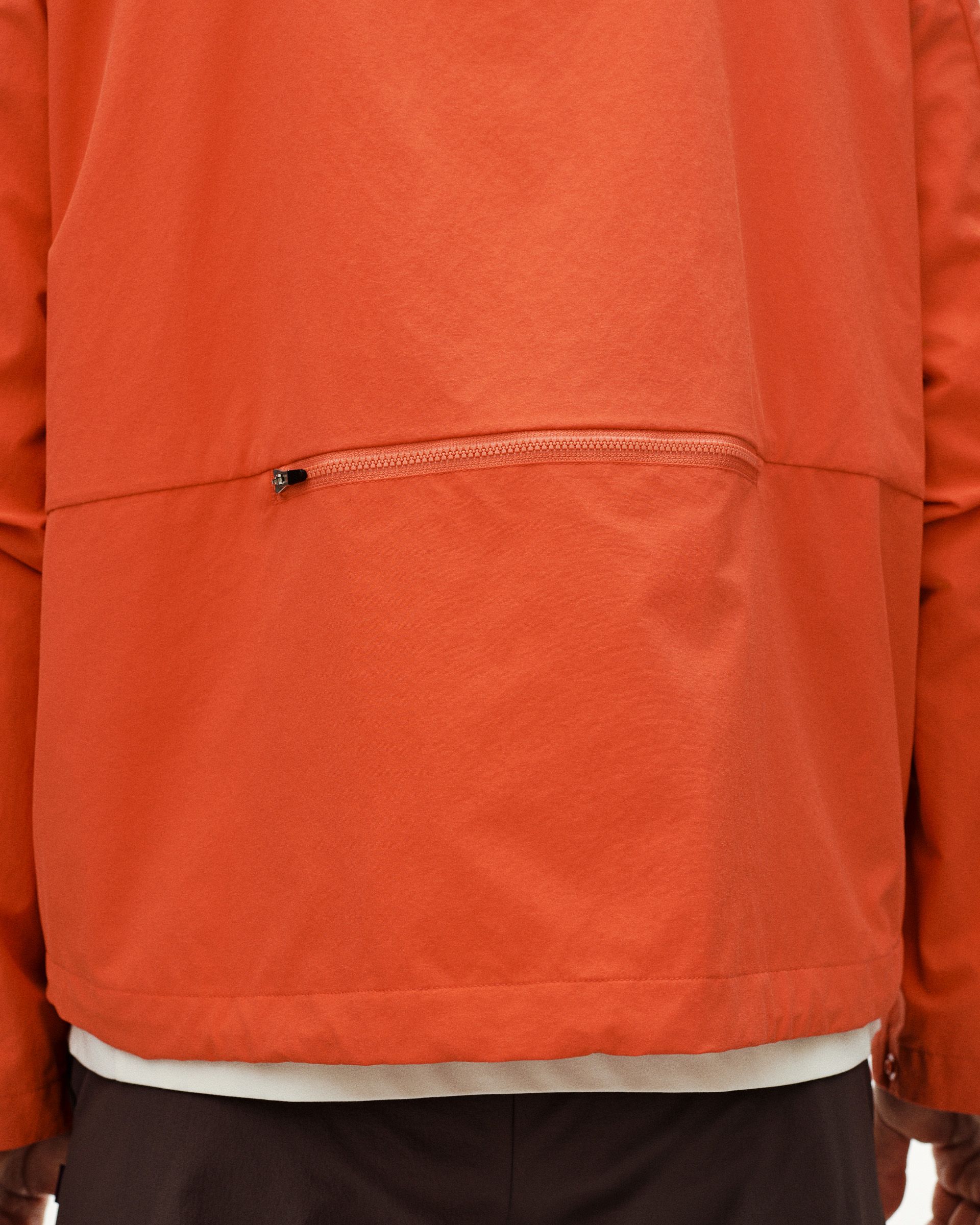 Orange Off-Race Utility jacket, detail view showing zip chest pocket