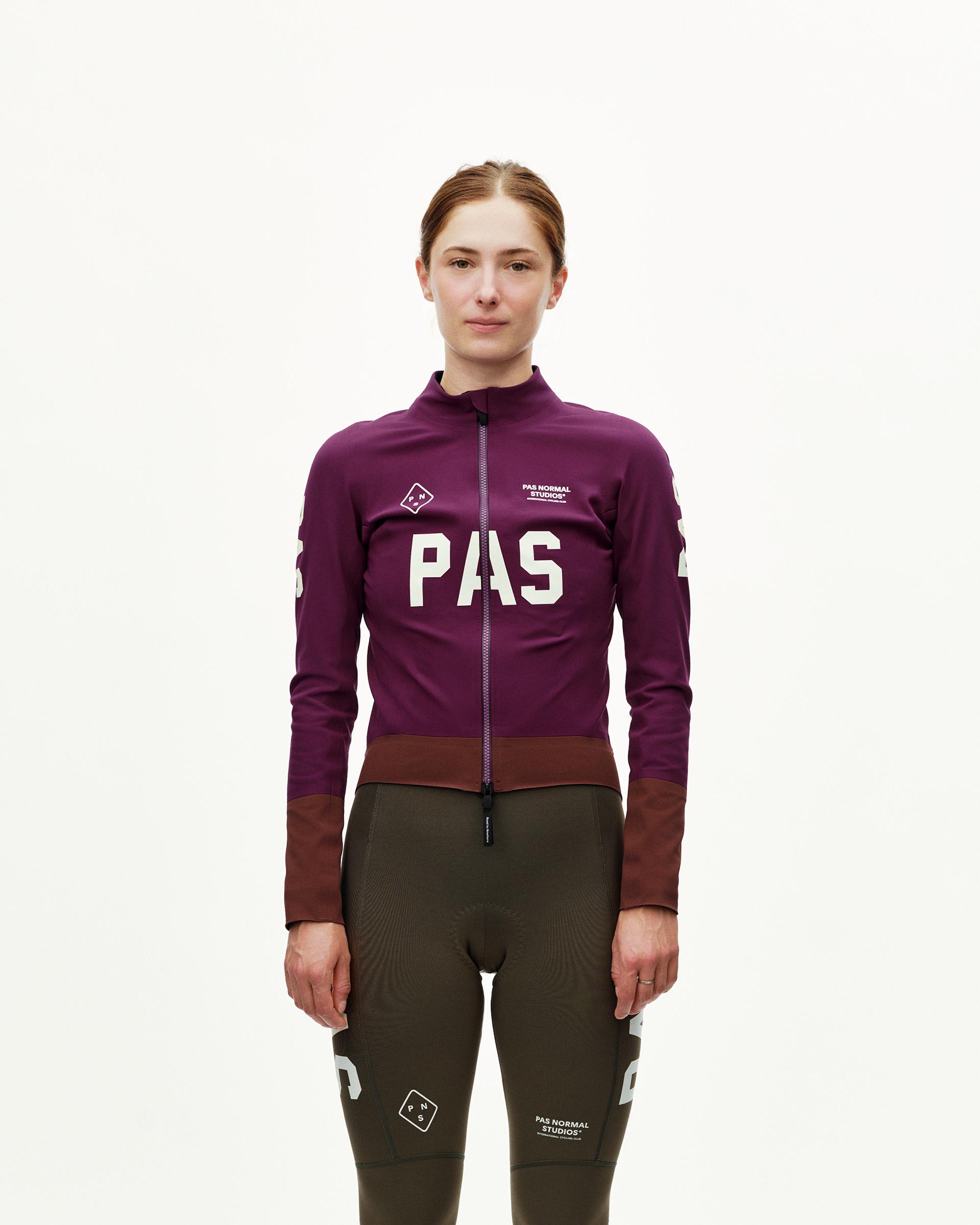 Dark Purple PAS Mechanism Thermal cycling jacket on model, front view with large chest logo and contrast dark hem panel