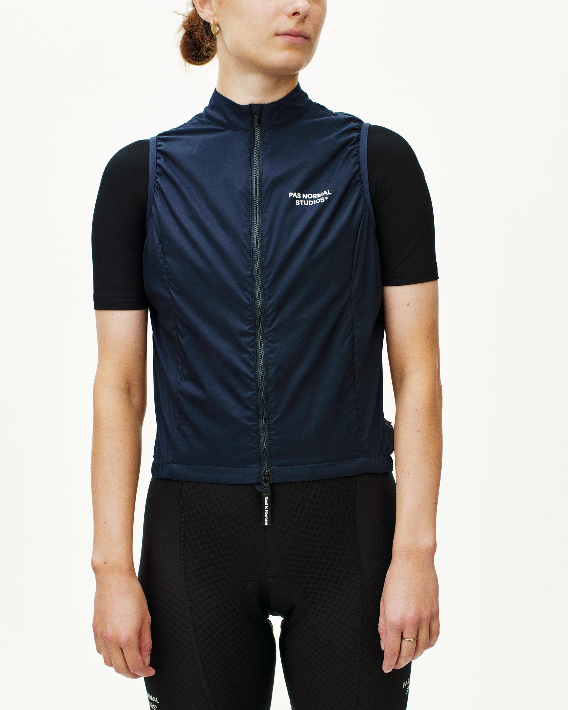 Navy Essential Insulated cycling gilet on model with white chest logo and full zip front