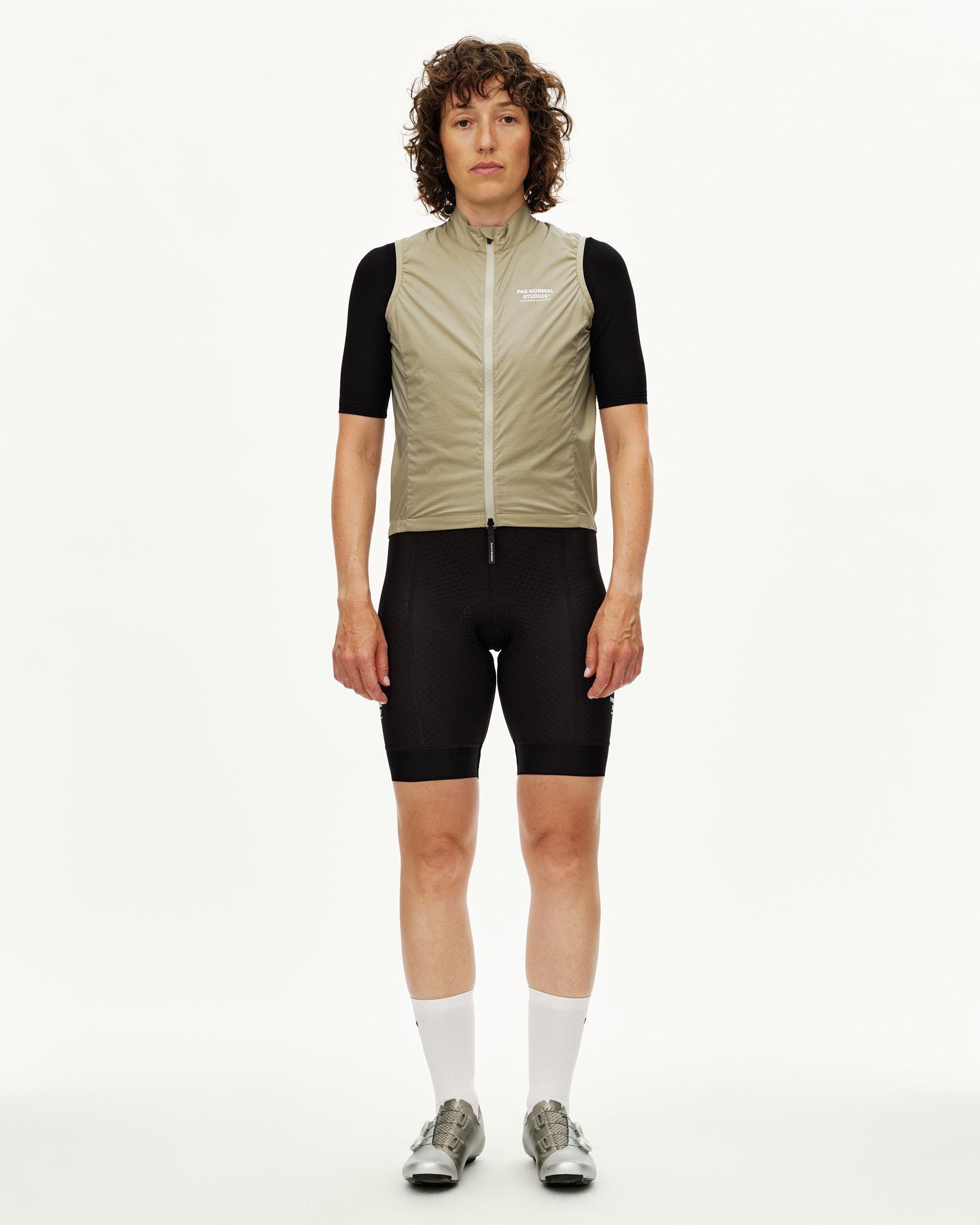 Grey Sage Essential cycling gilet on model, front view with full zip and white chest logo
