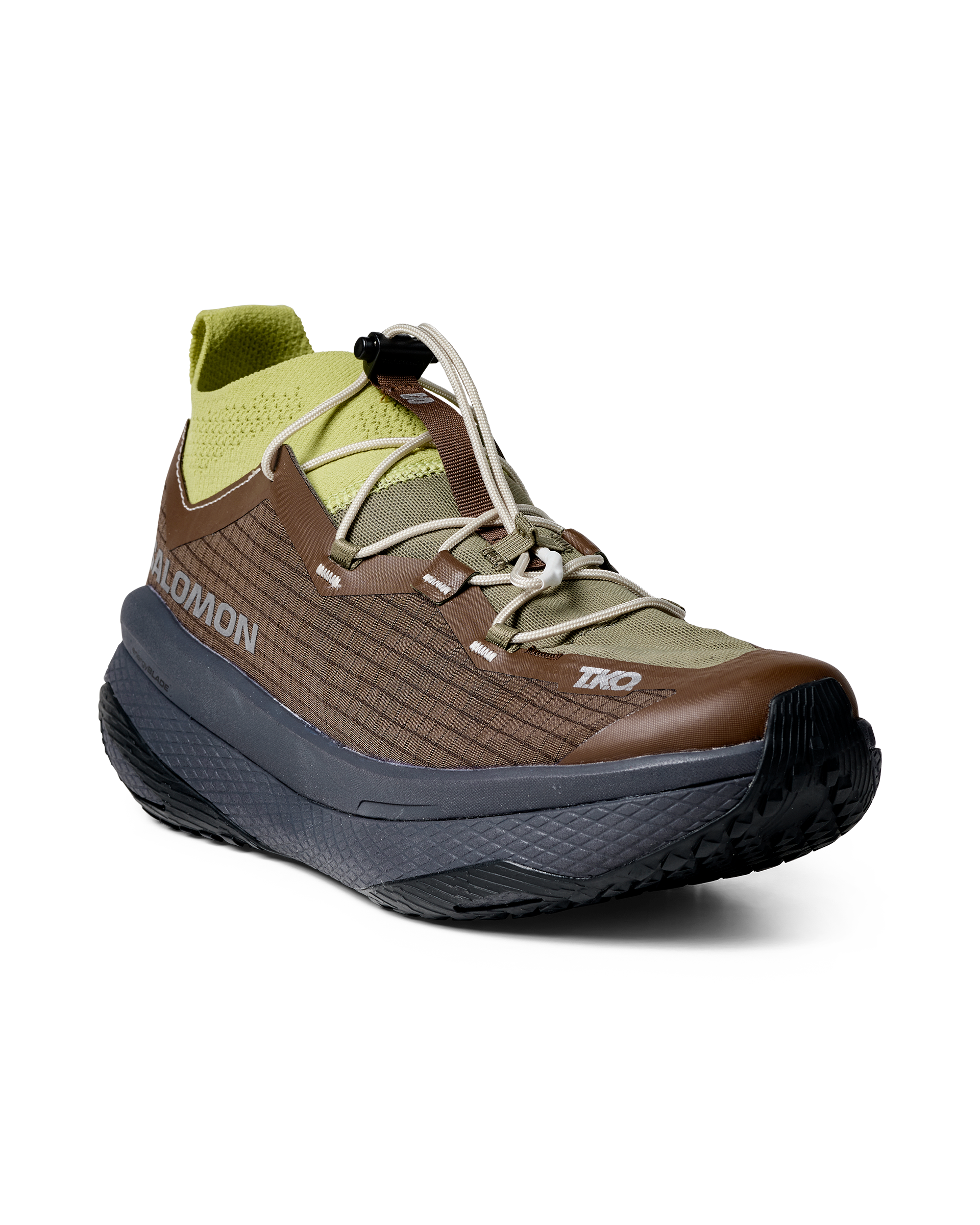 Green Salomon T.K.O. GRVL CONCEPT trail running shoe, three-quarter view with toggle lacing system