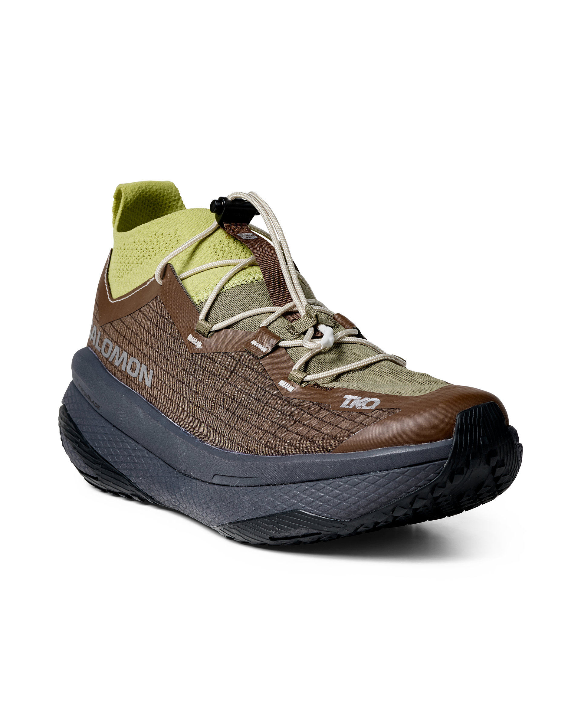 Green Salomon T.K.O. GRVL CONCEPT trail running shoe, three-quarter view with toggle lacing system
