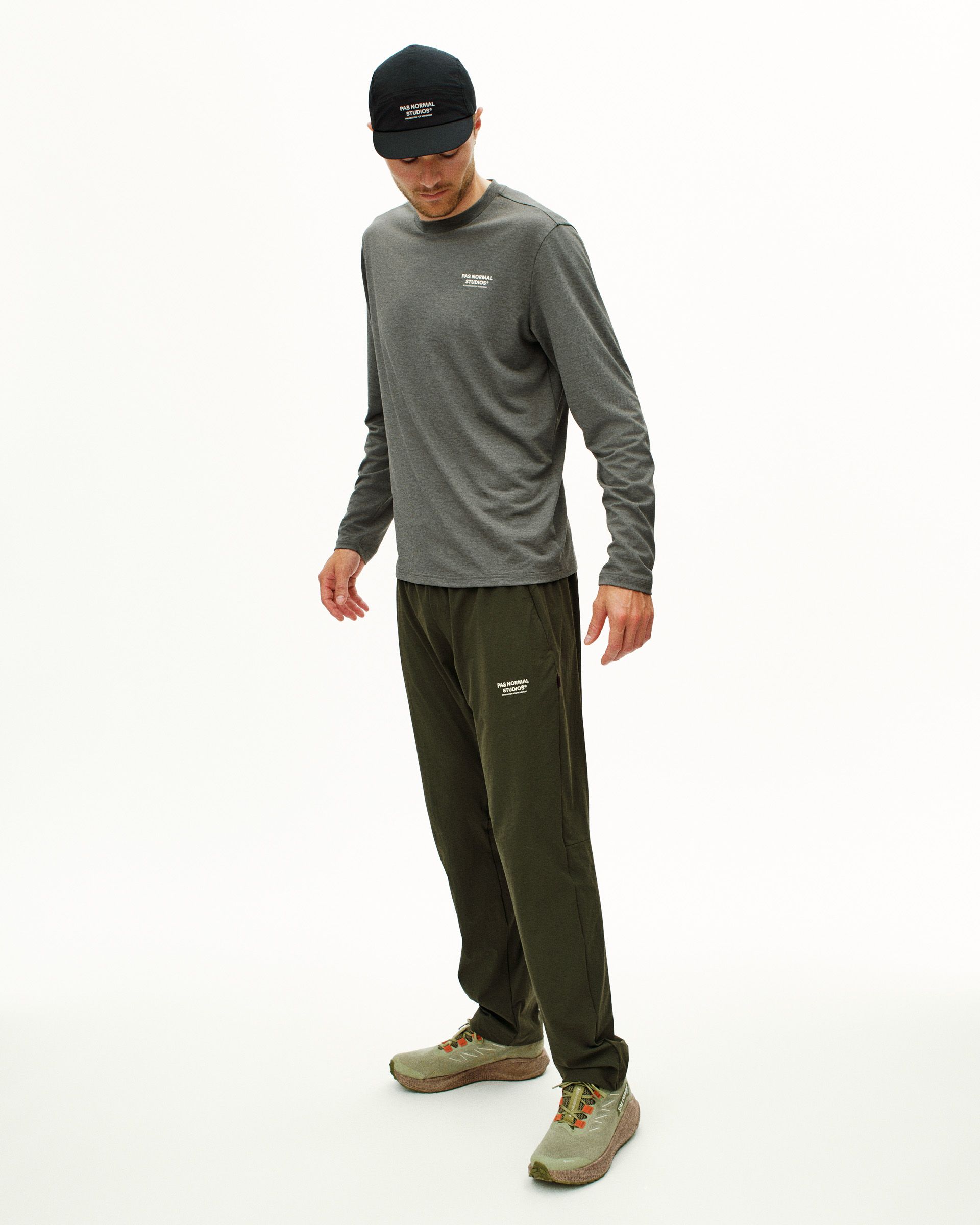 Dark Olive Balance pants on model with relaxed fit and elastic waistband
