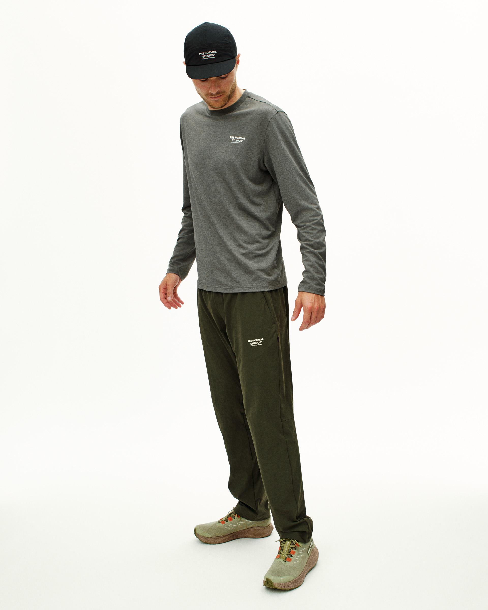 Dark Olive Balance pants on model with relaxed fit and elastic waistband