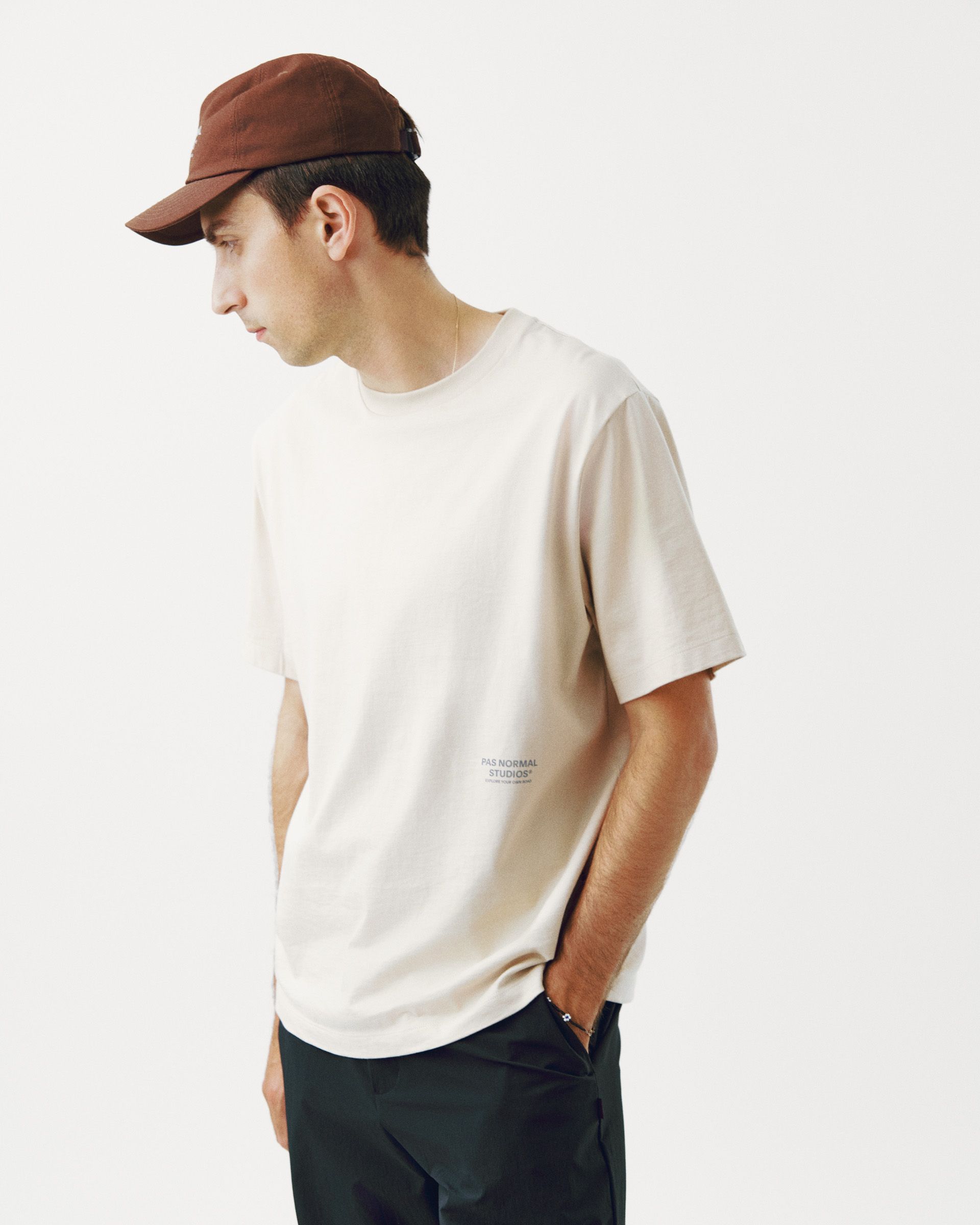 Bone Off-Race T-shirt on model with side view and small chest logo