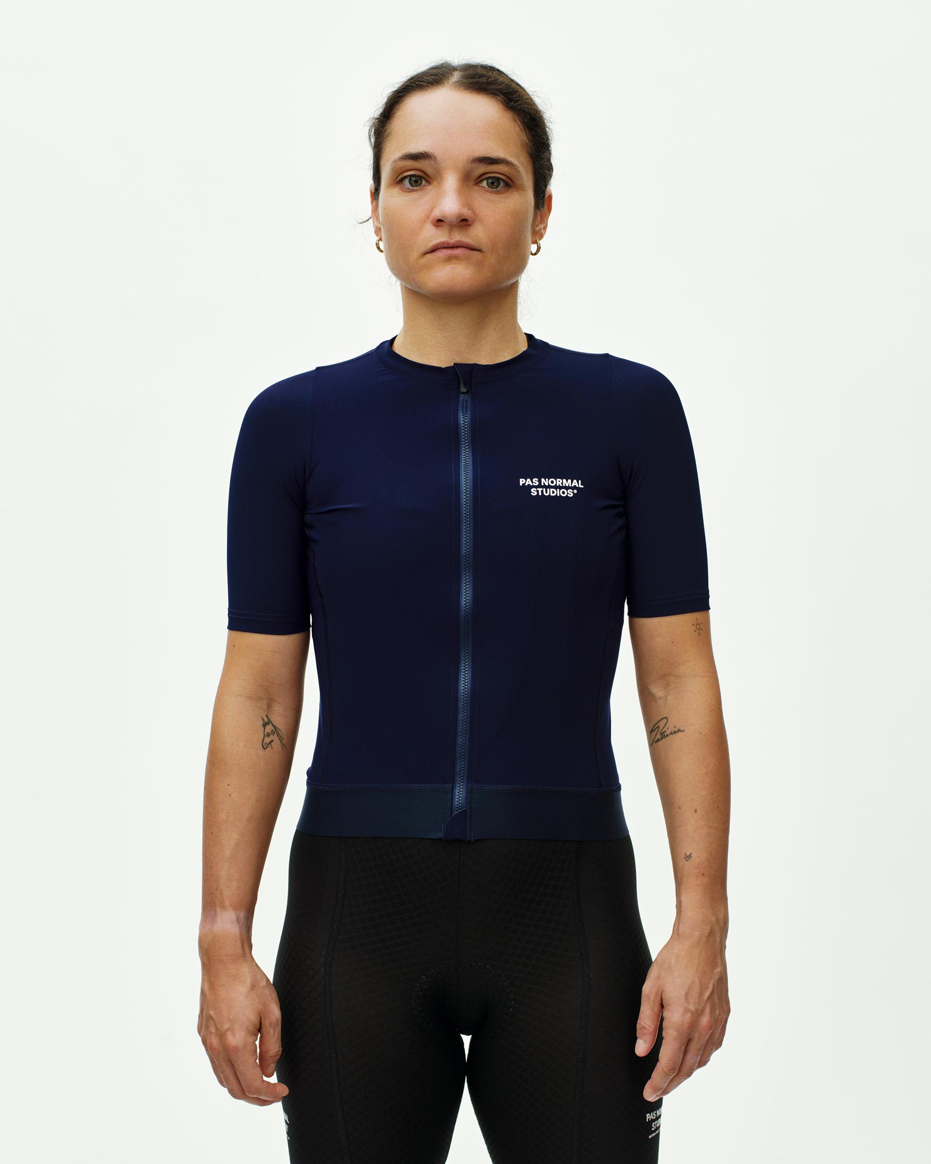Navy Essential cycling jersey on model with full zip and white chest logo