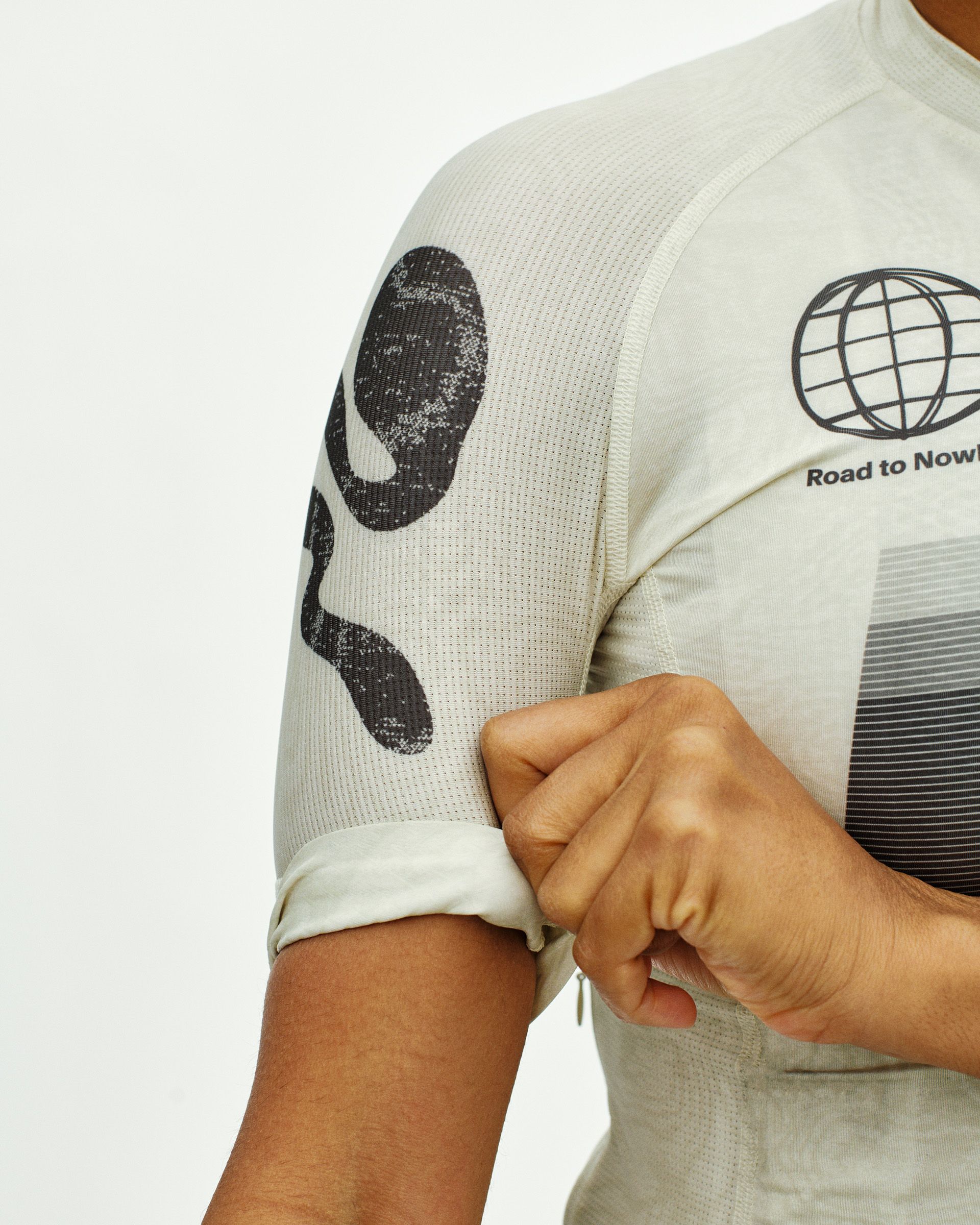 Off White Mechanism Logo cycling jersey, detail view on model showing globe chest print and sleeve zip