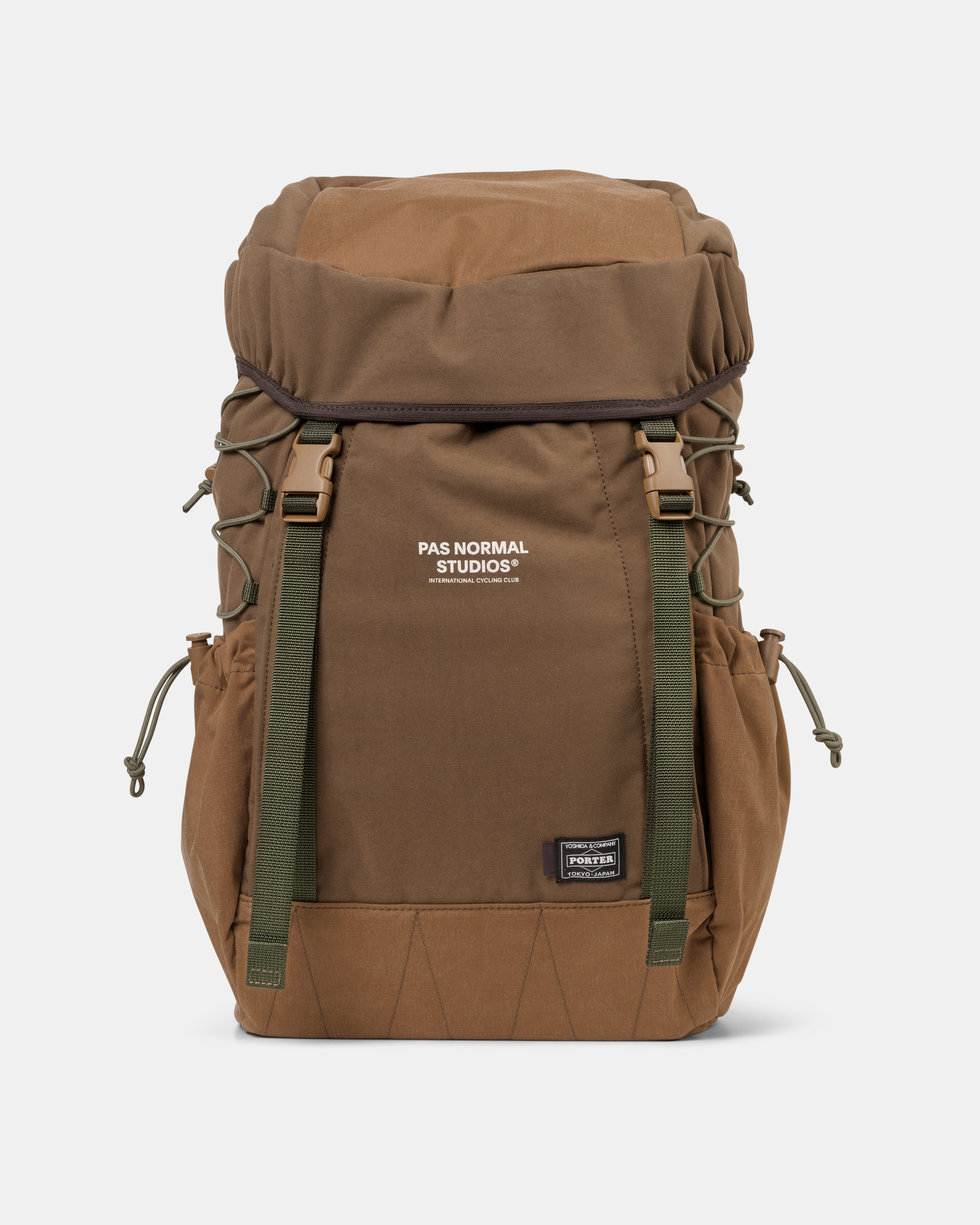 Light Brown Porter-Yoshida backpack, front view with green webbing straps and buckles
