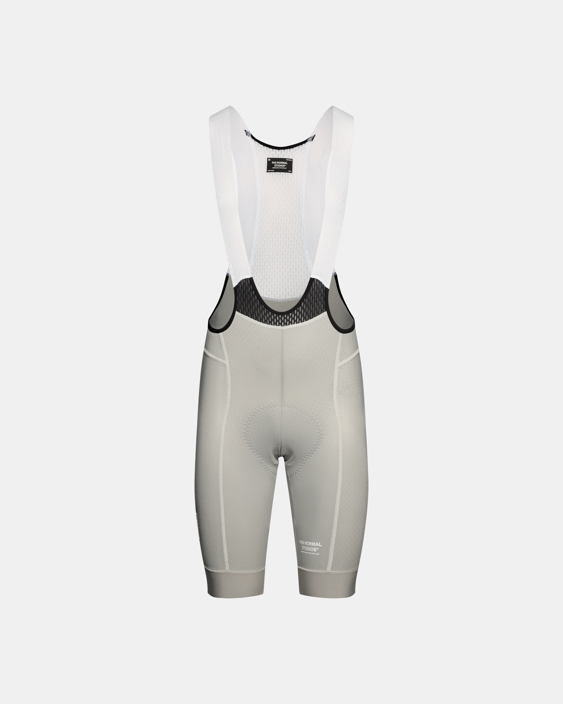 Light Grey Breakfast Club Mechanism cycling bibs, front flat lay with white mesh upper and black waistband