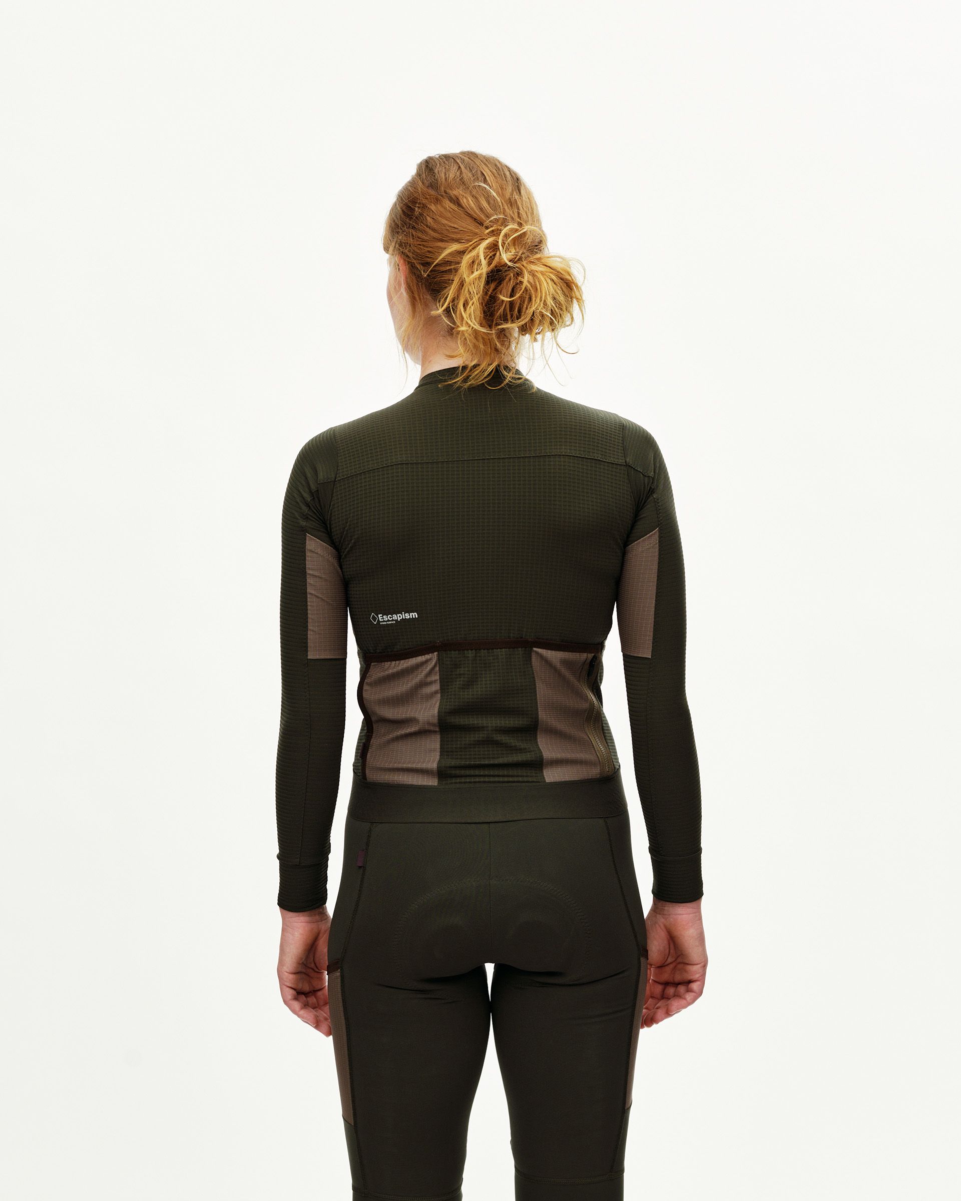 Dark Olive Escapism long sleeve cycling jersey on model, rear view with contrast back pockets