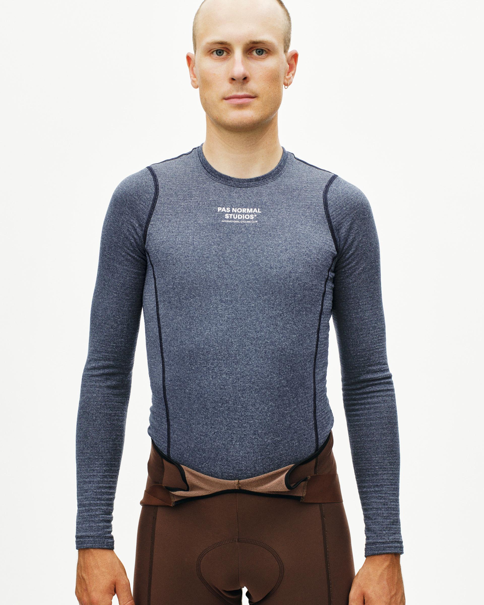 Navy thermal long sleeve base layer on model with white chest logo
