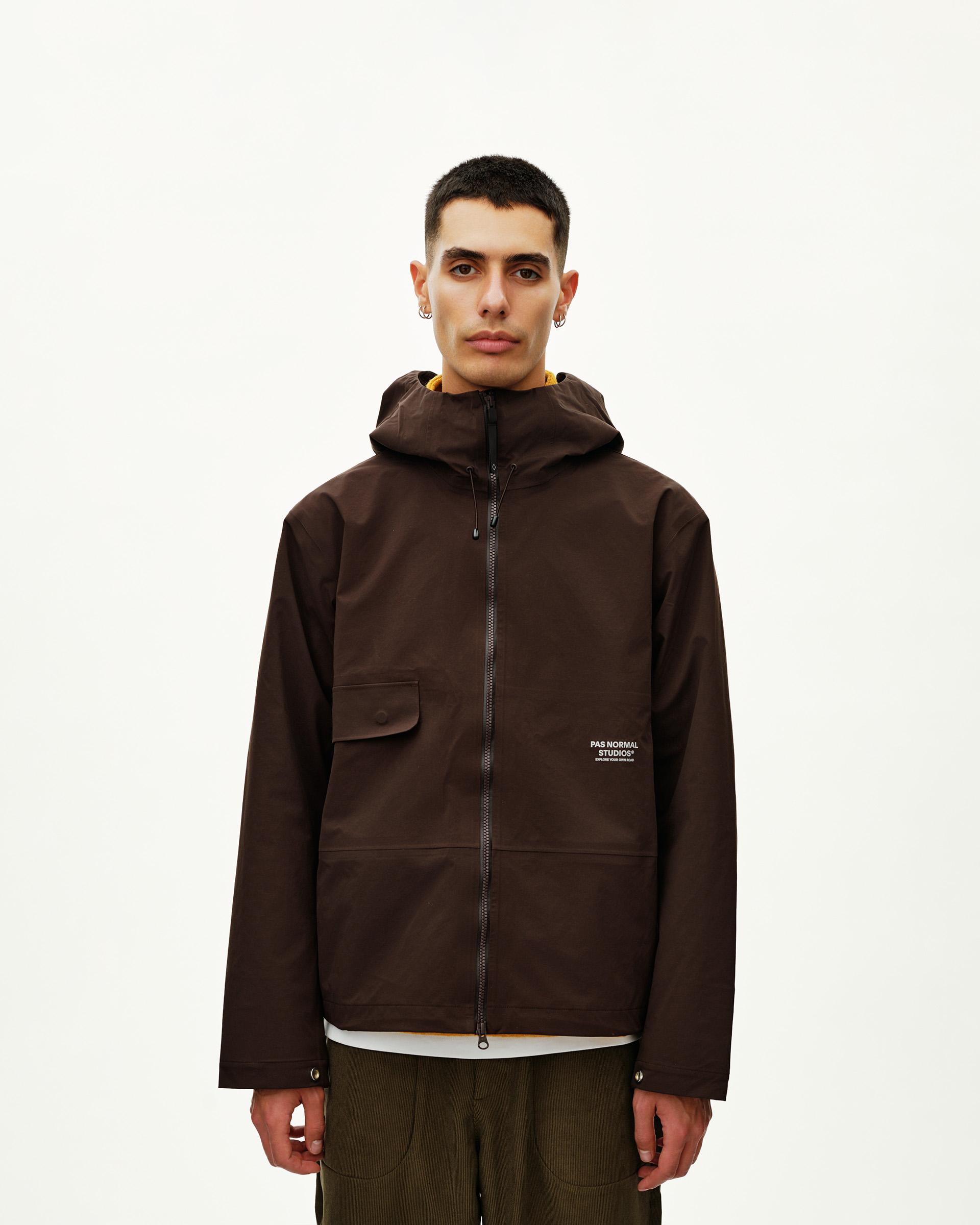 Dark Coffee brown Off-Race 3L Shell jacket on model, front view with chest patch pocket and full zip