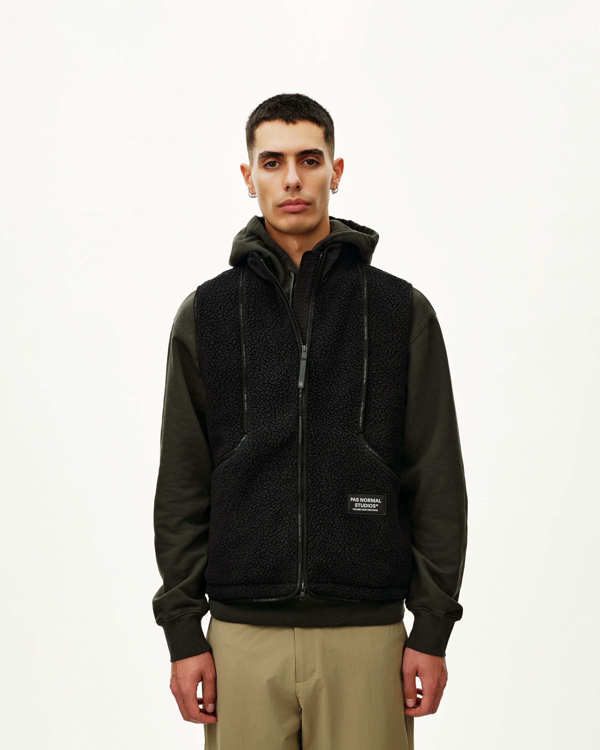 Black Off-Race Pile Fleece Vest on model, front view with full zip and brand patch