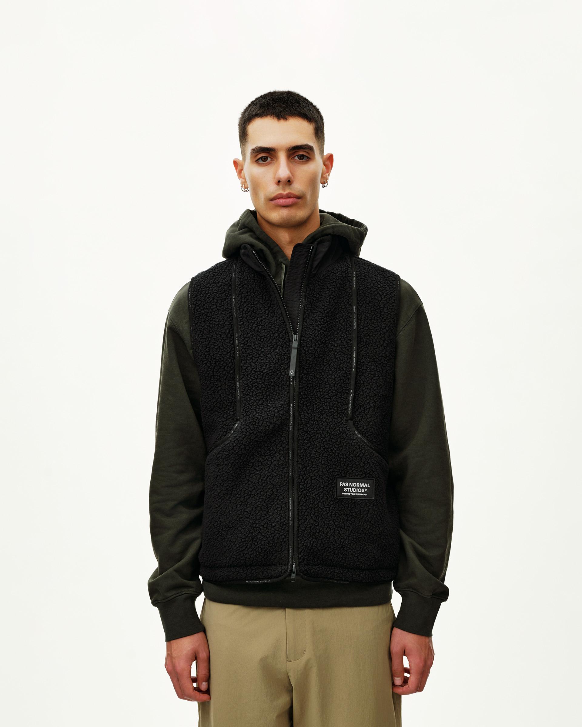 Black Off-Race Pile Fleece Vest on model, front view with full zip and brand patch
