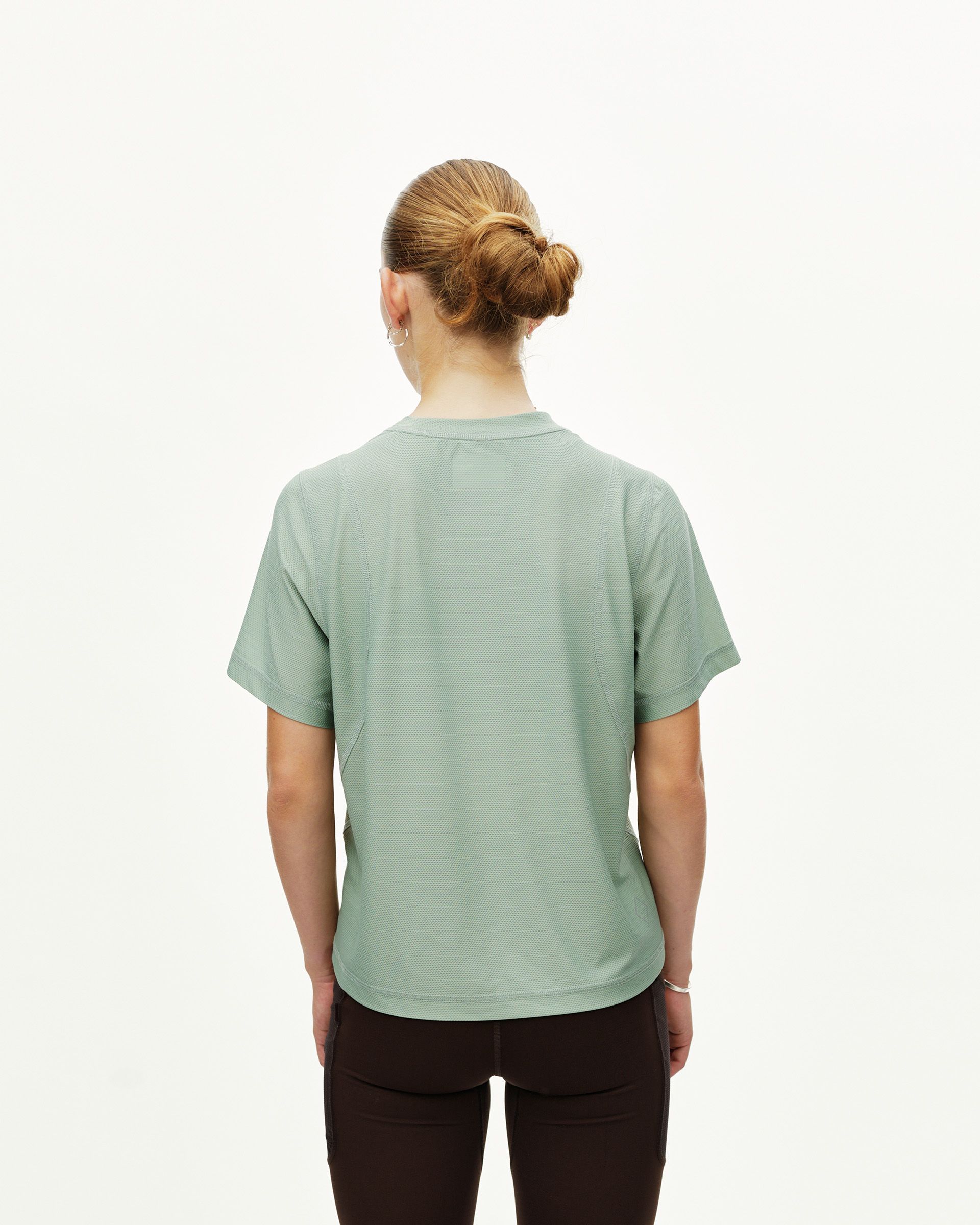 Green Sage Balance women's T-shirt, rear view on model with textured fabric panels