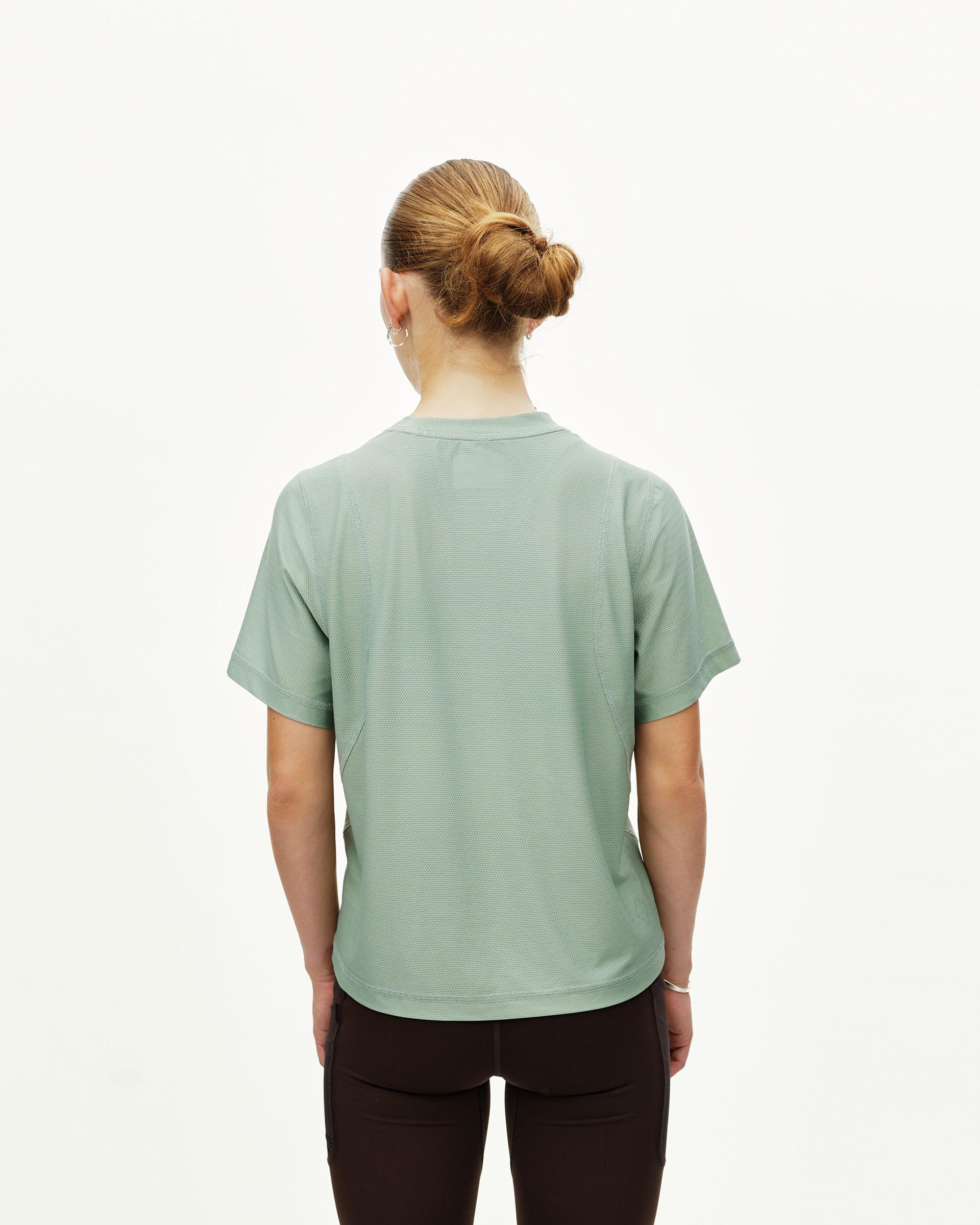 Green Sage Balance women's T-shirt, rear view on model with textured fabric panels