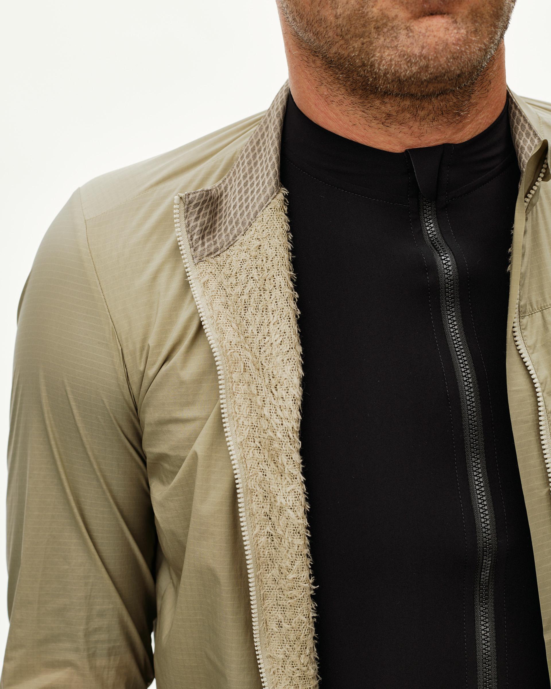 Grey Sage Essential Insulated jacket, front detail on model with open zip showing textured inner lining