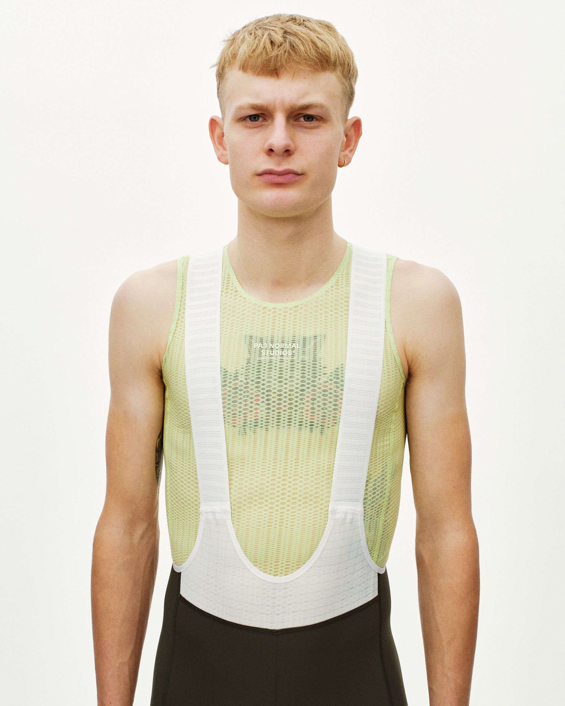 Green Mechanism Pro Sleeveless cycling baselayer on model with mesh panel construction