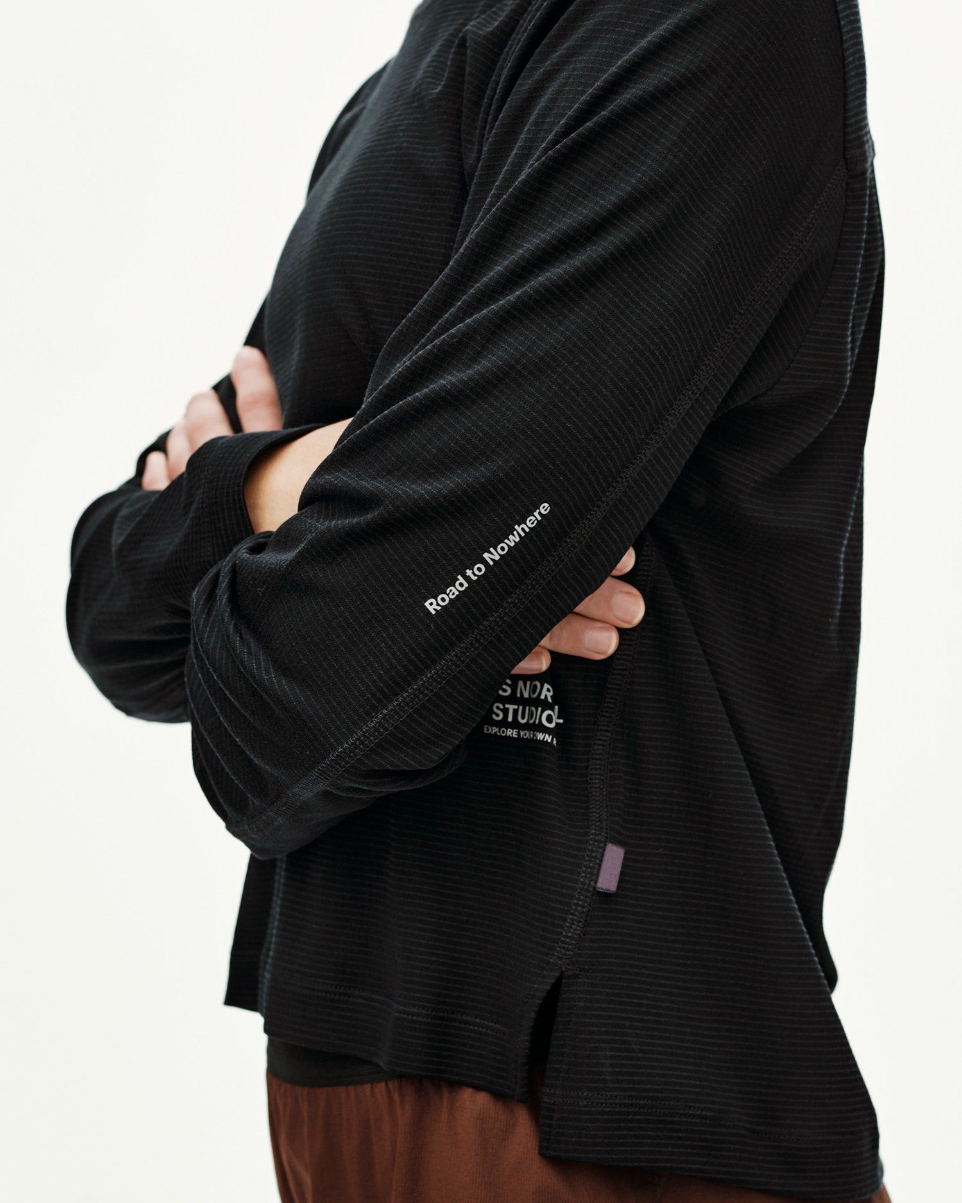Black Balance long sleeve T-shirt, side detail on model with Road to Nowhere sleeve print and ribbed texture