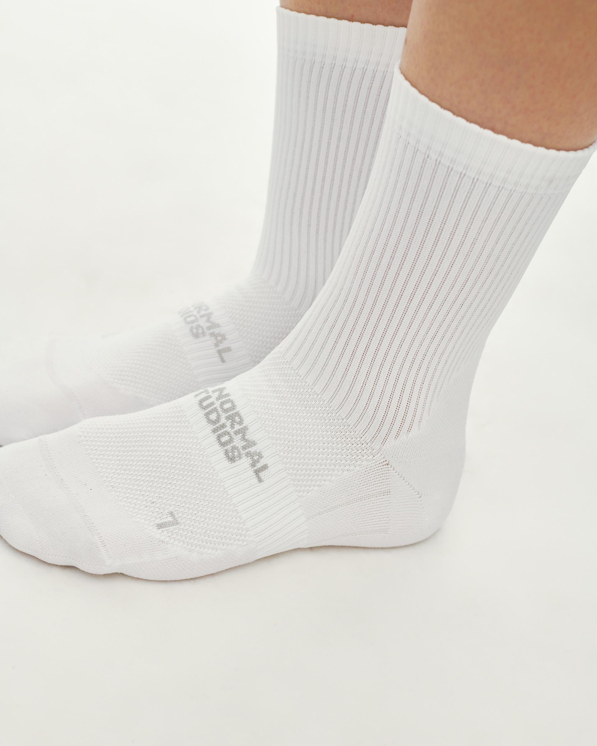 White Balance Quarter Socks, side view on model showing ribbed cuff and grey logo print