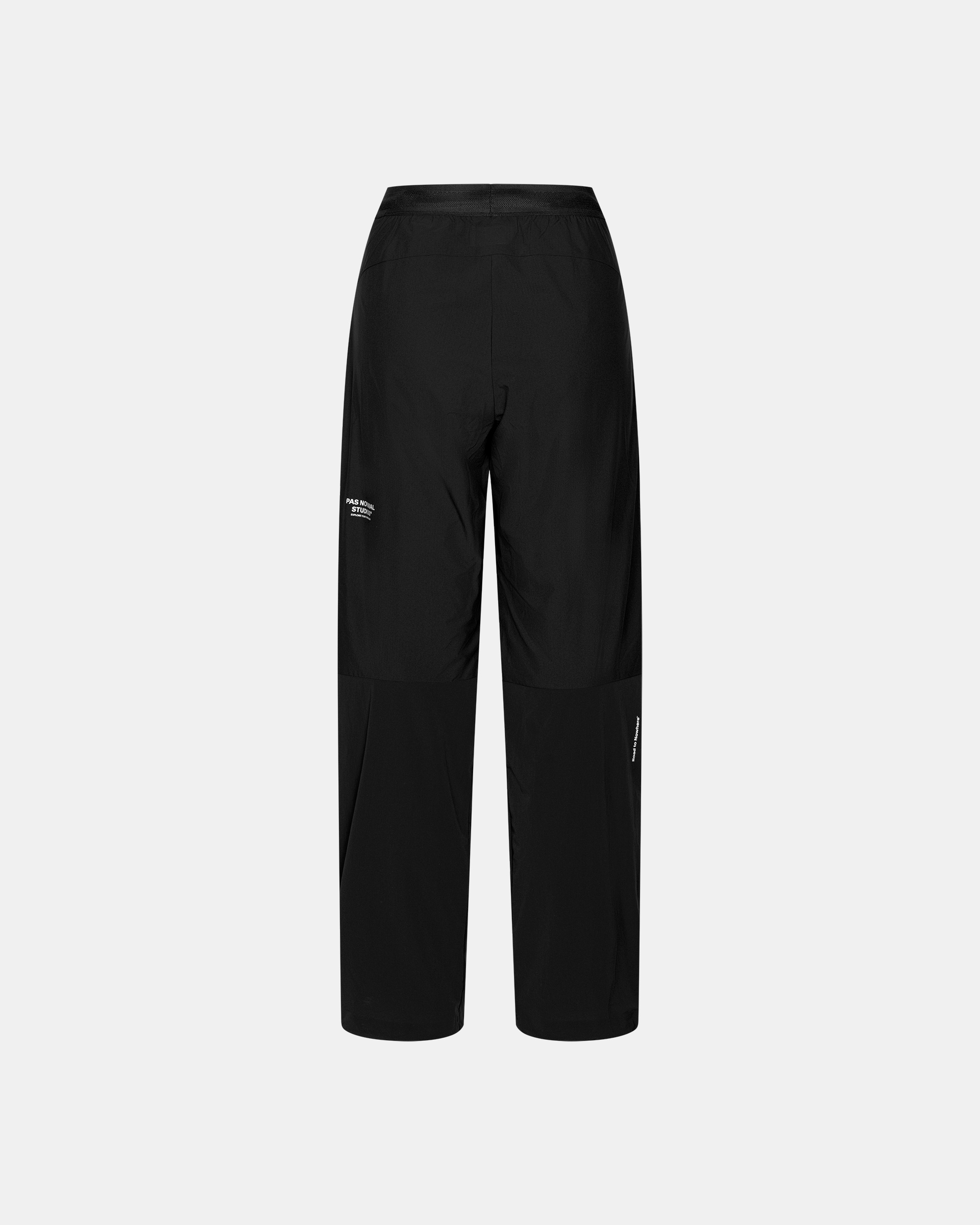 Black Balance Performance Pants, rear flat lay with elastic waistband and white logo print