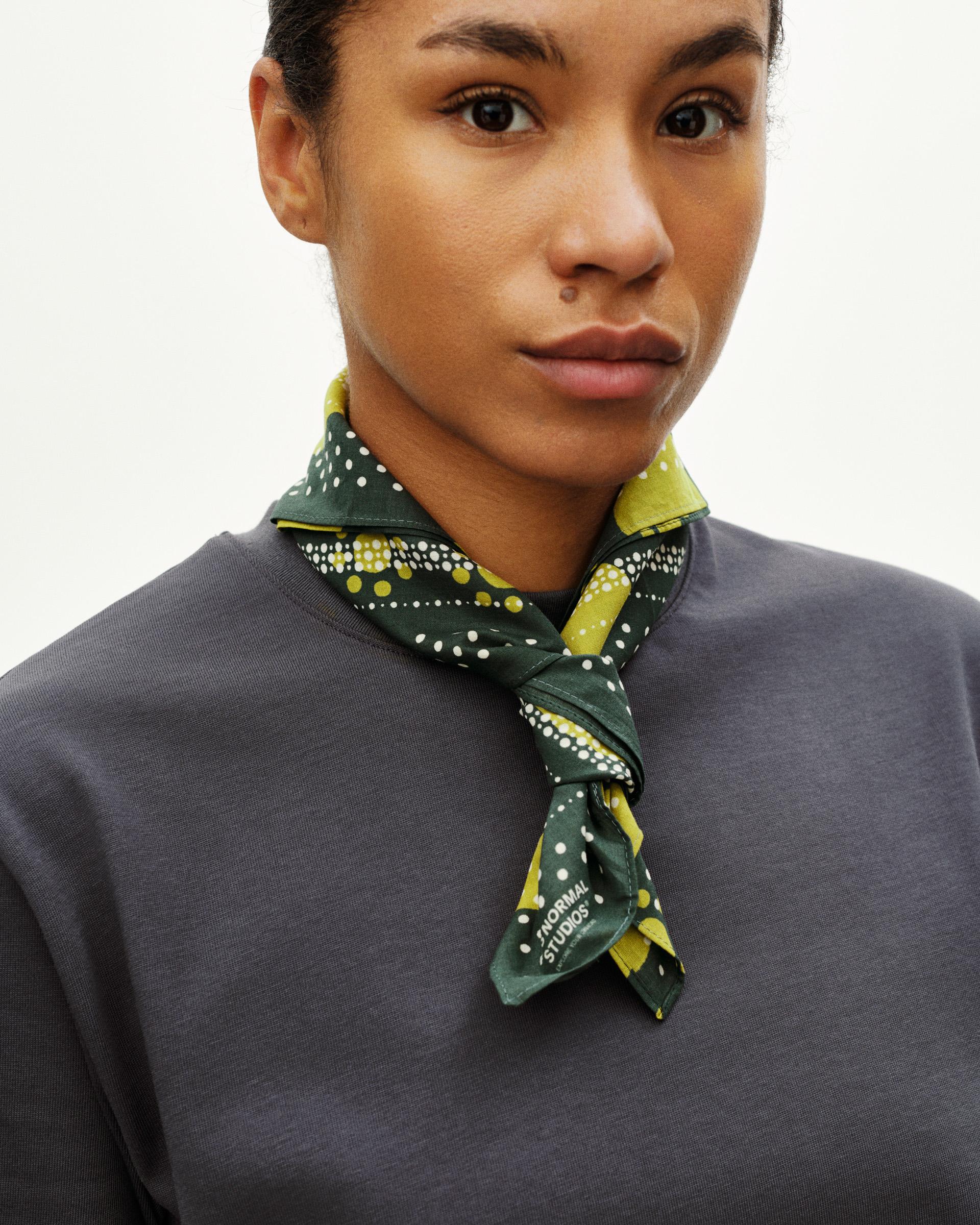 Green Off-Race bandana on model with yellow and white polka dot pattern