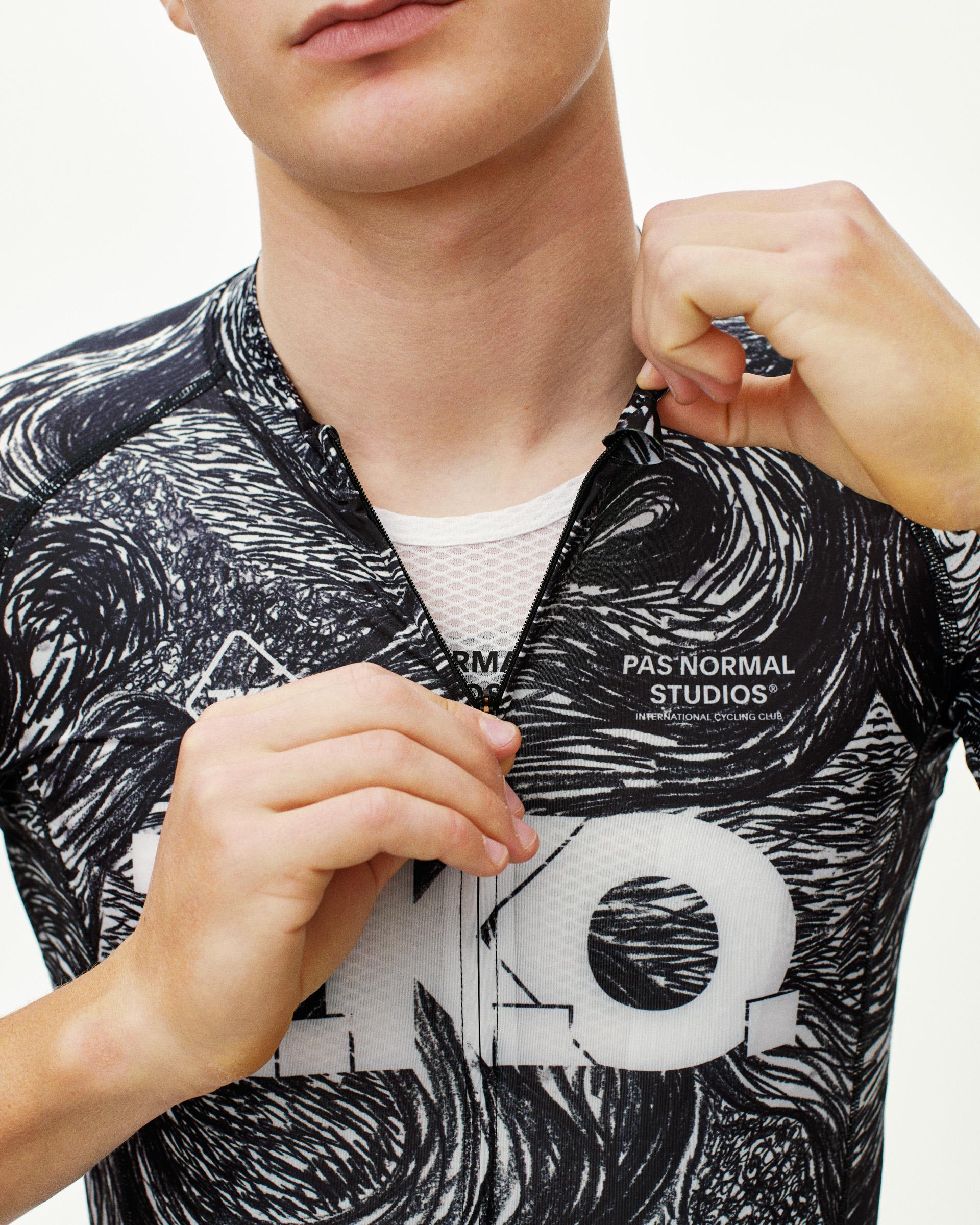 Iron Grey T.K.O. Mechanism cycling jersey, front detail on model with swirl AOP print and open zip