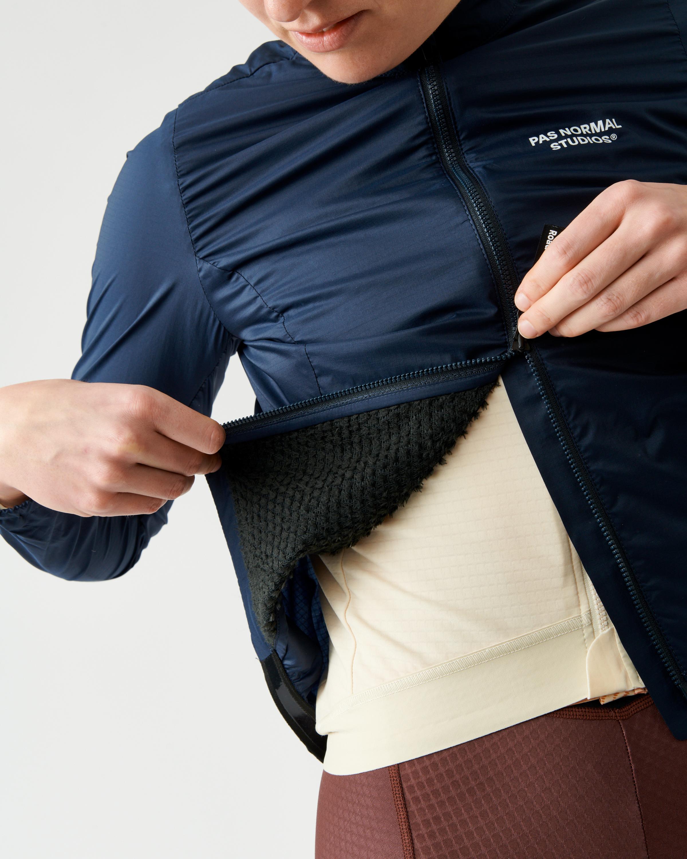Navy Essential Insulated cycling jacket on model showing quilted panels and mesh inner lining