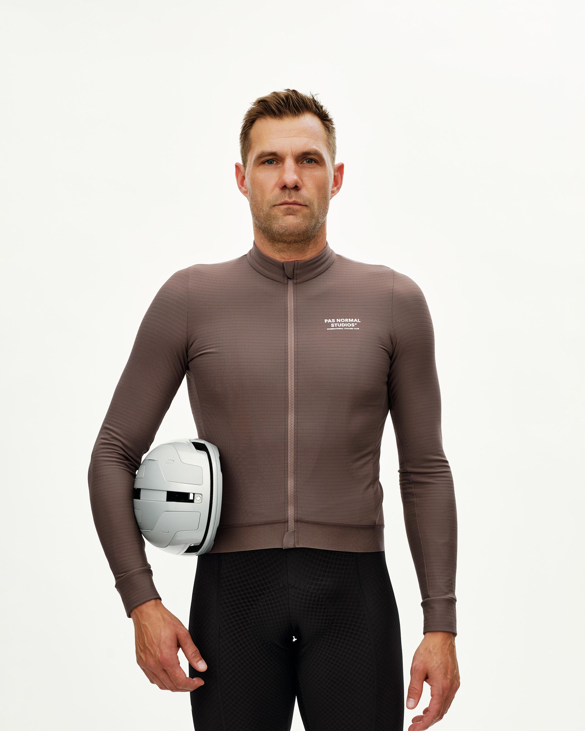 Dusty Plum Essential long sleeve cycling jersey on model, front view with chest logo print