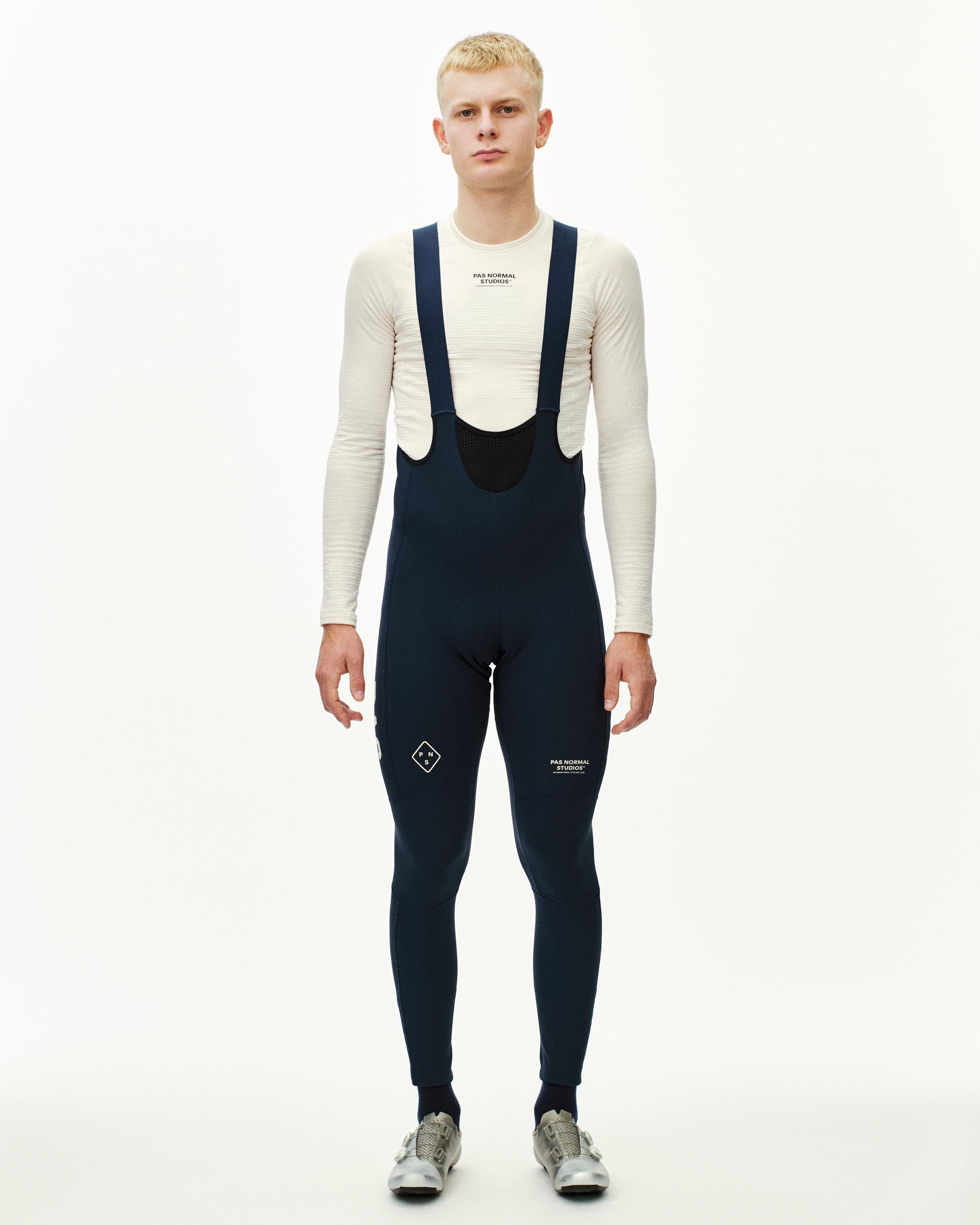 Navy PAS Mechanism Deep Winter Long cycling bibs on model, front view with suspenders