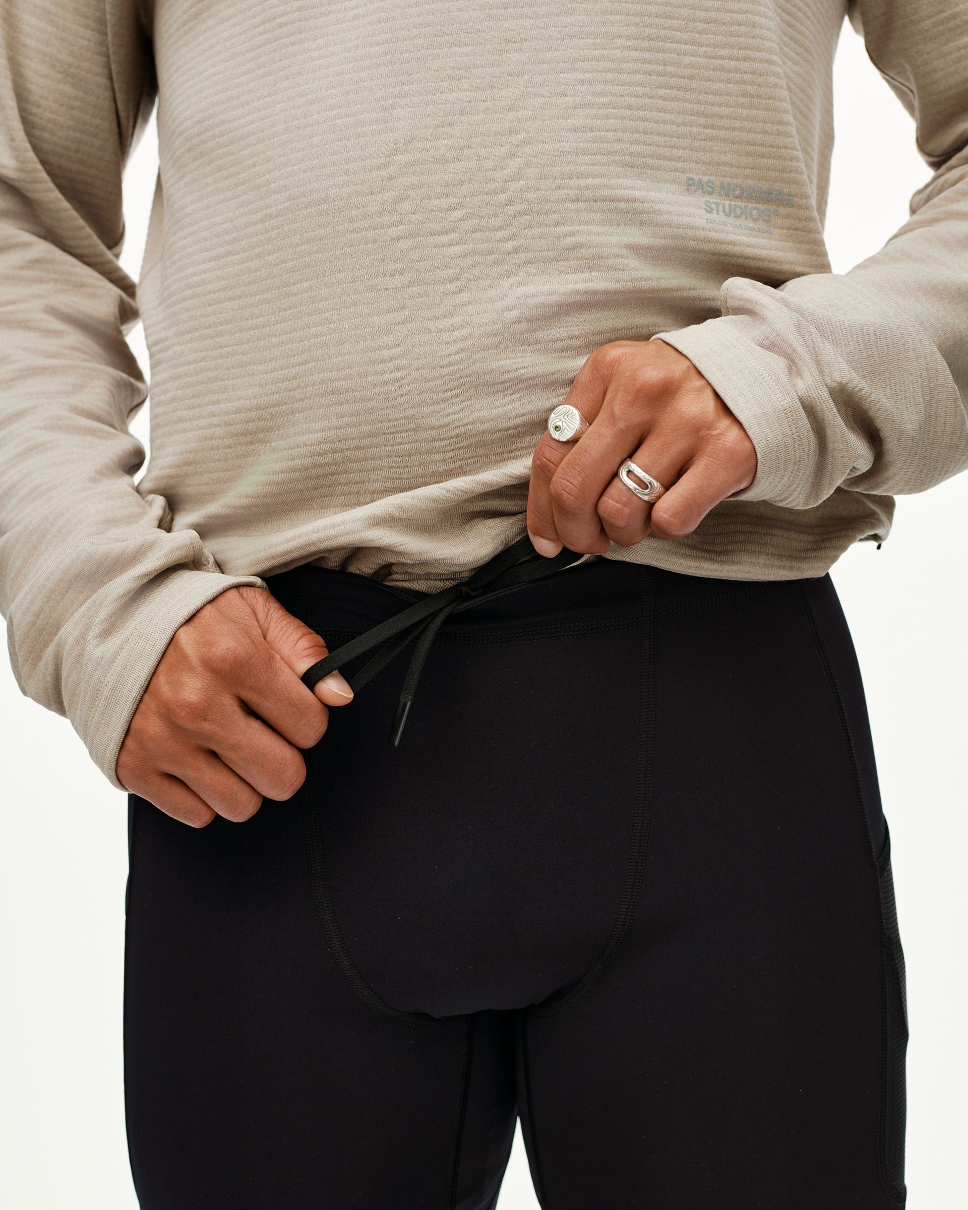 Black Balance long tights on model, front detail view with drawcord waistband