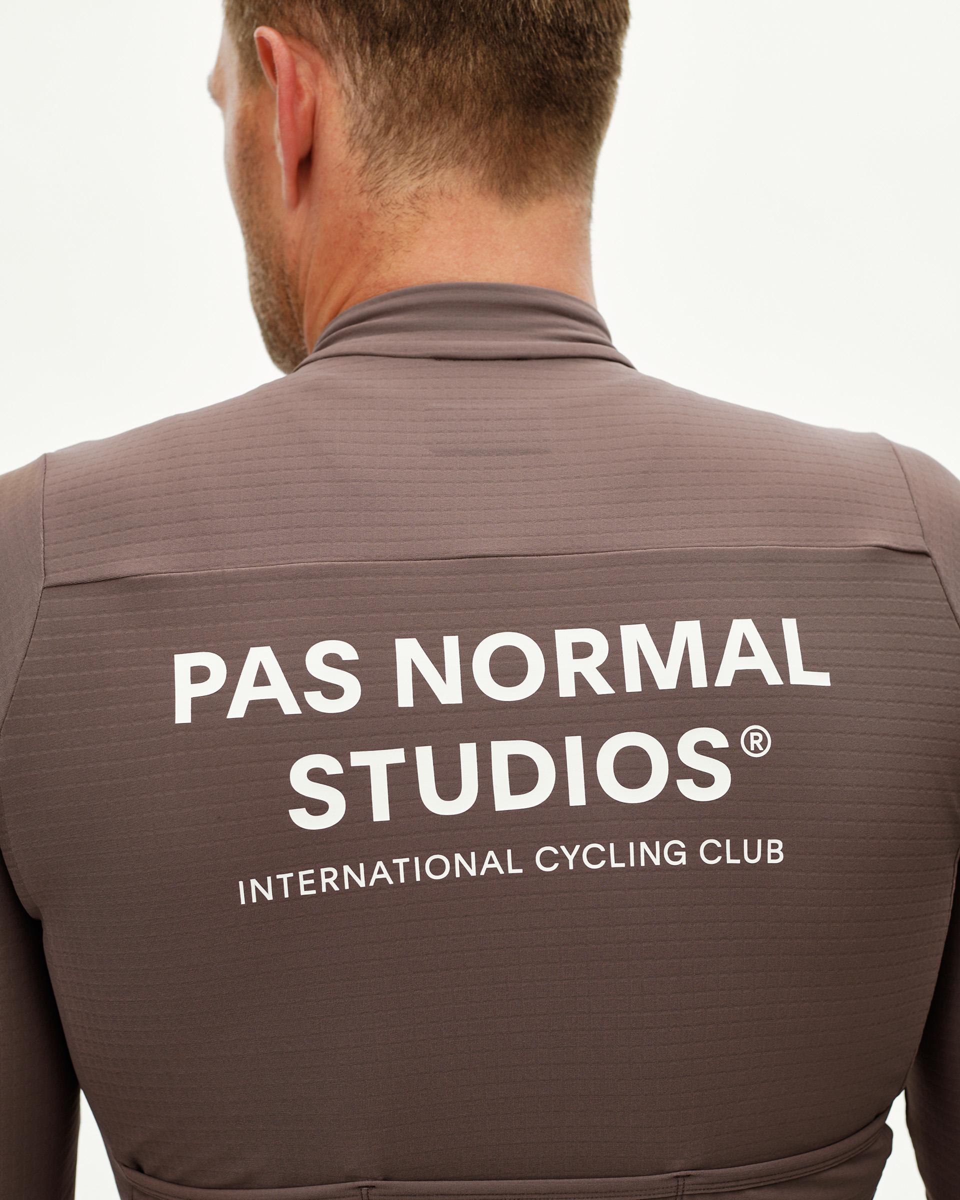 Dusty Plum Essential long sleeve cycling jersey, rear view on model with white back logo print