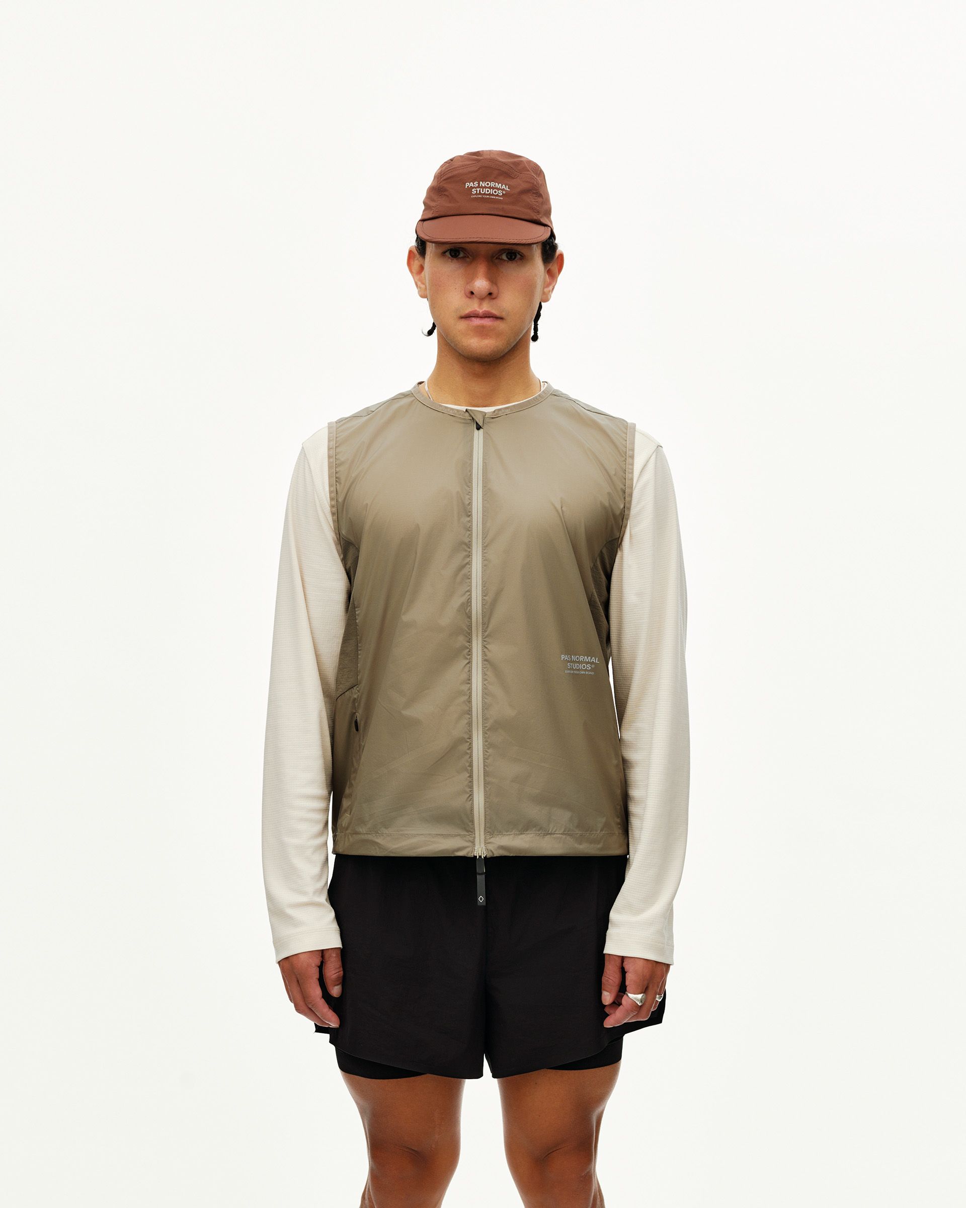 Dusty Earth khaki Balance Windproof Vest on model, front view with full zip and sleeveless cut