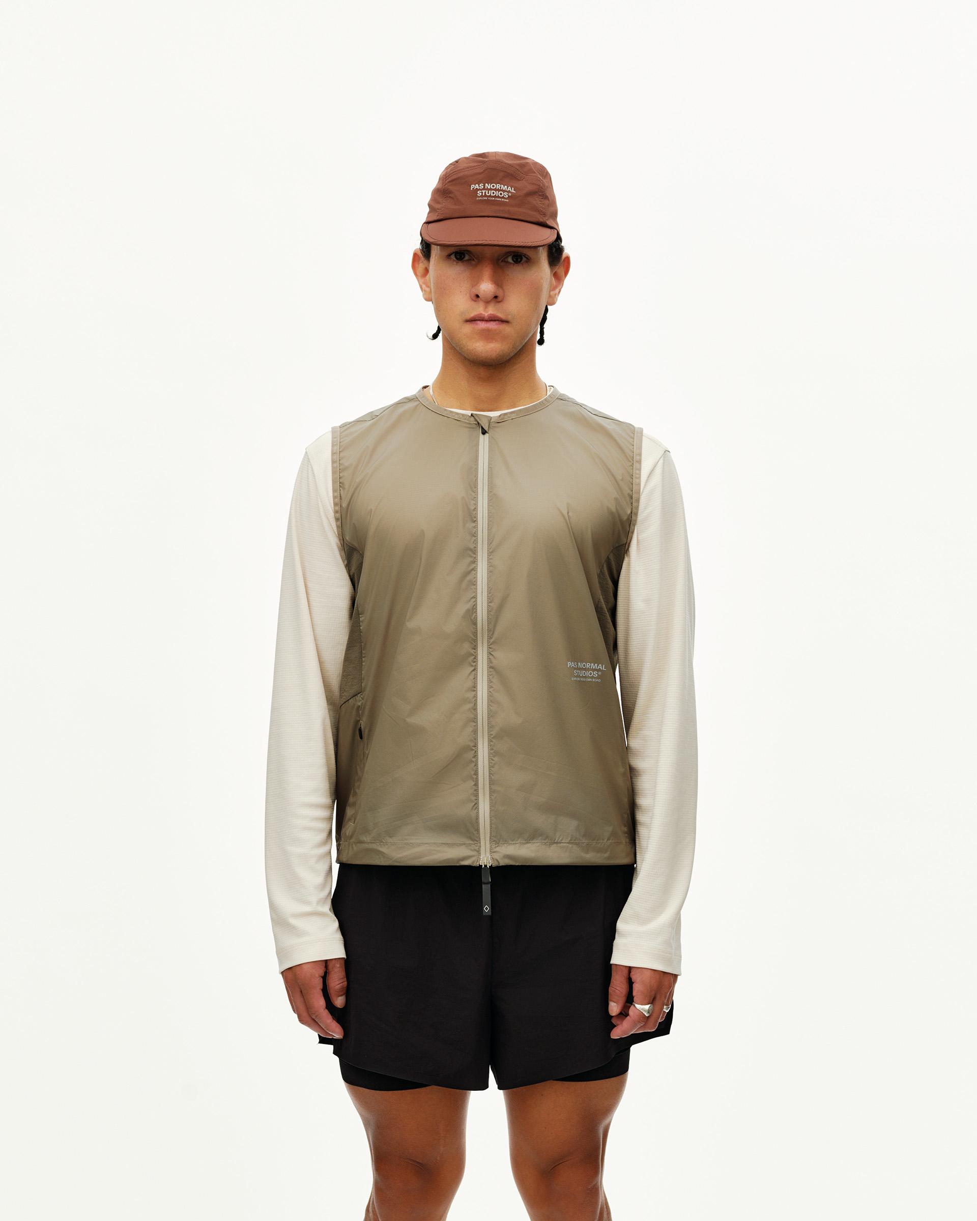 Dusty Earth khaki Balance Windproof Vest on model, front view with full zip and sleeveless cut