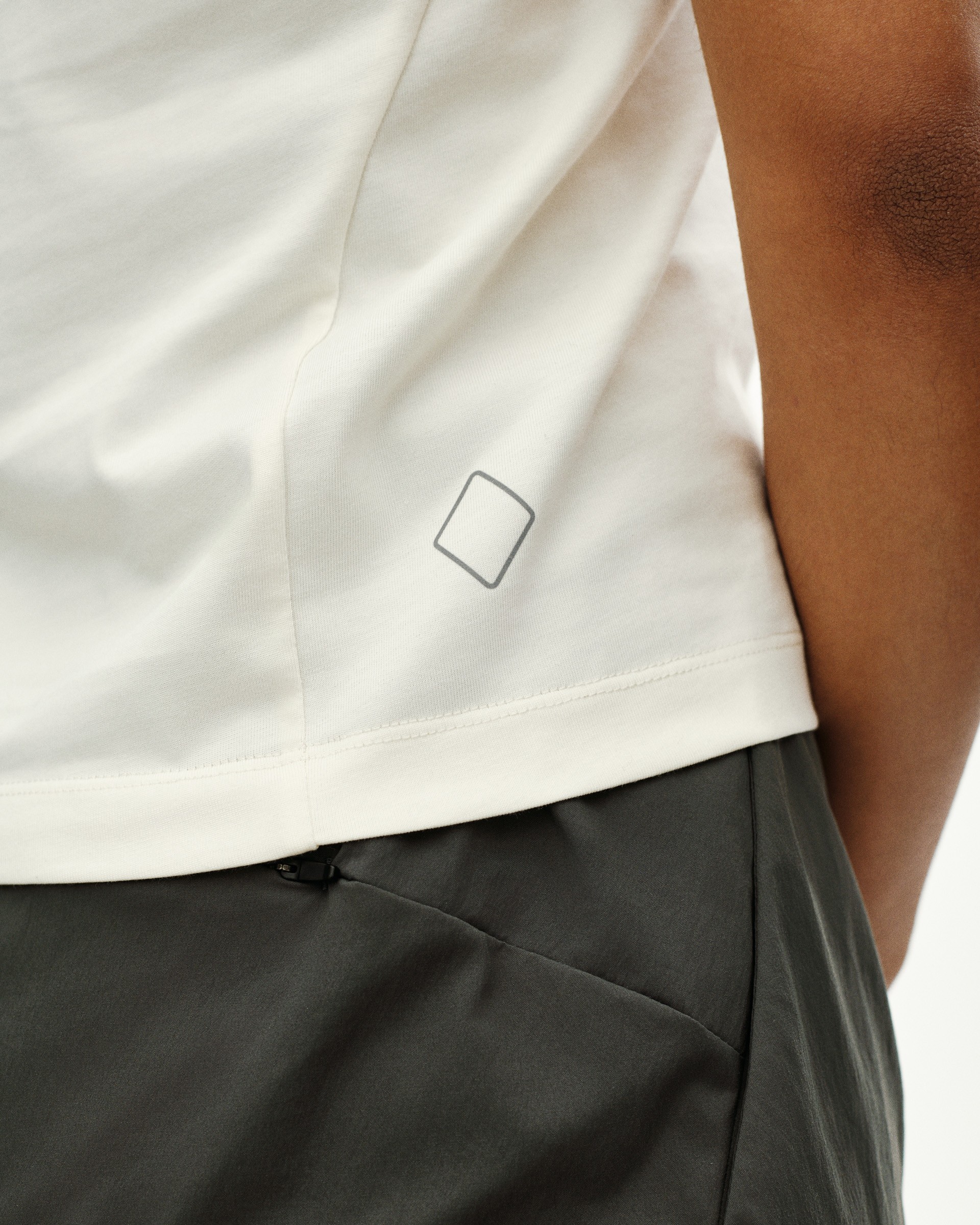 White Off-Race Cotton Tech Top t-shirt on model with small square logo print