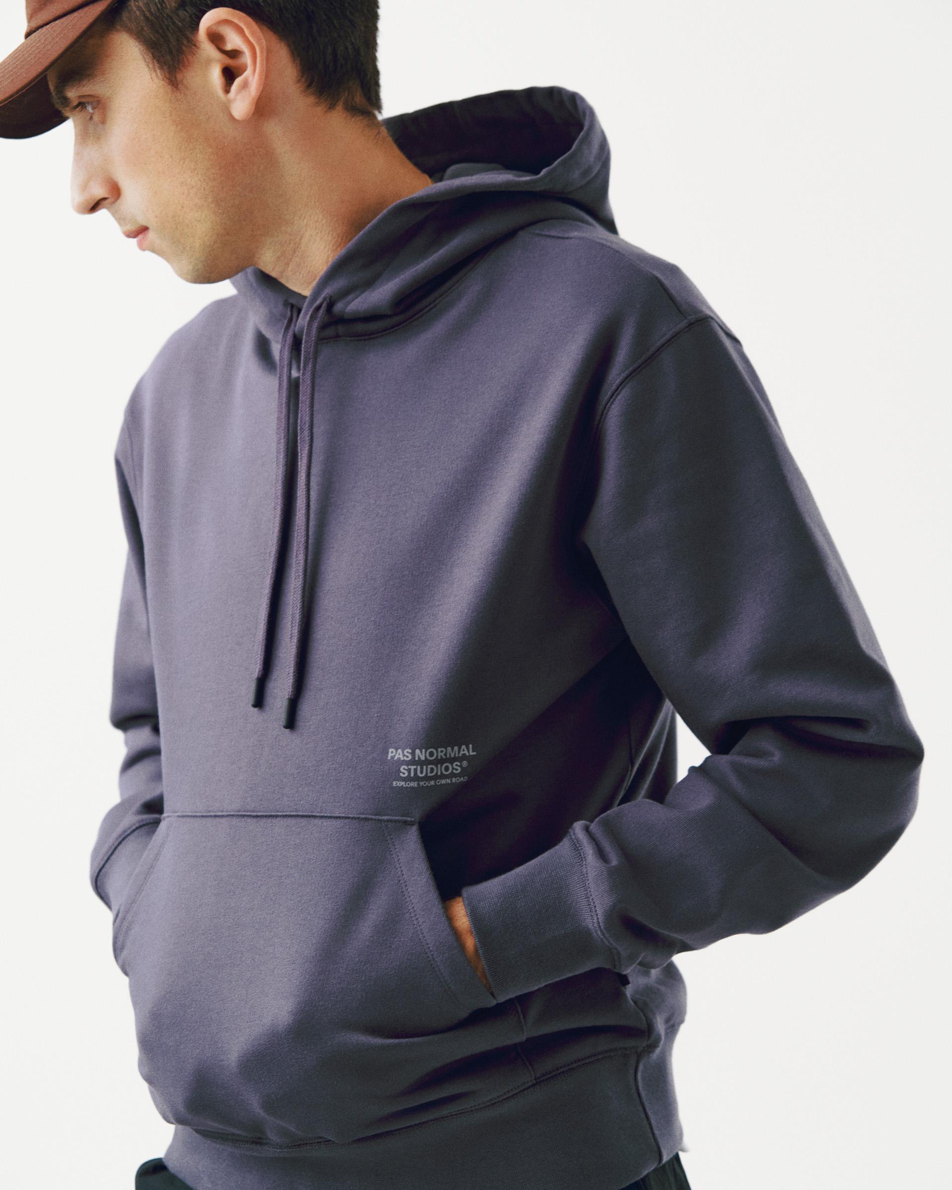 Grey Off-Race hoodie on model with kangaroo pocket and drawstring hood