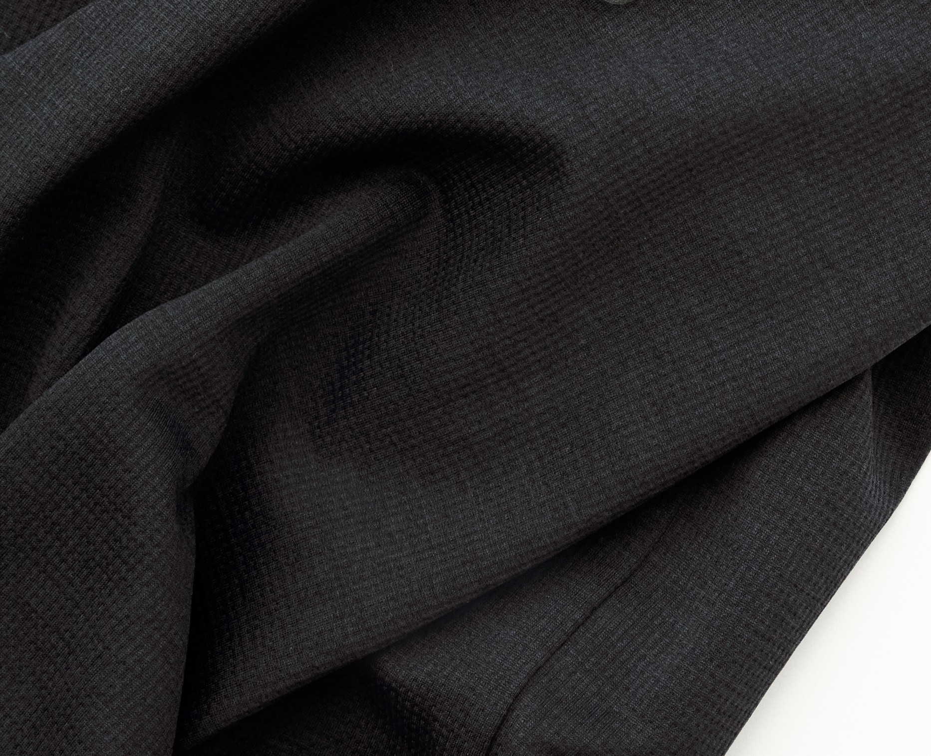 Black Balance singlet, detail view with small grey logo dot