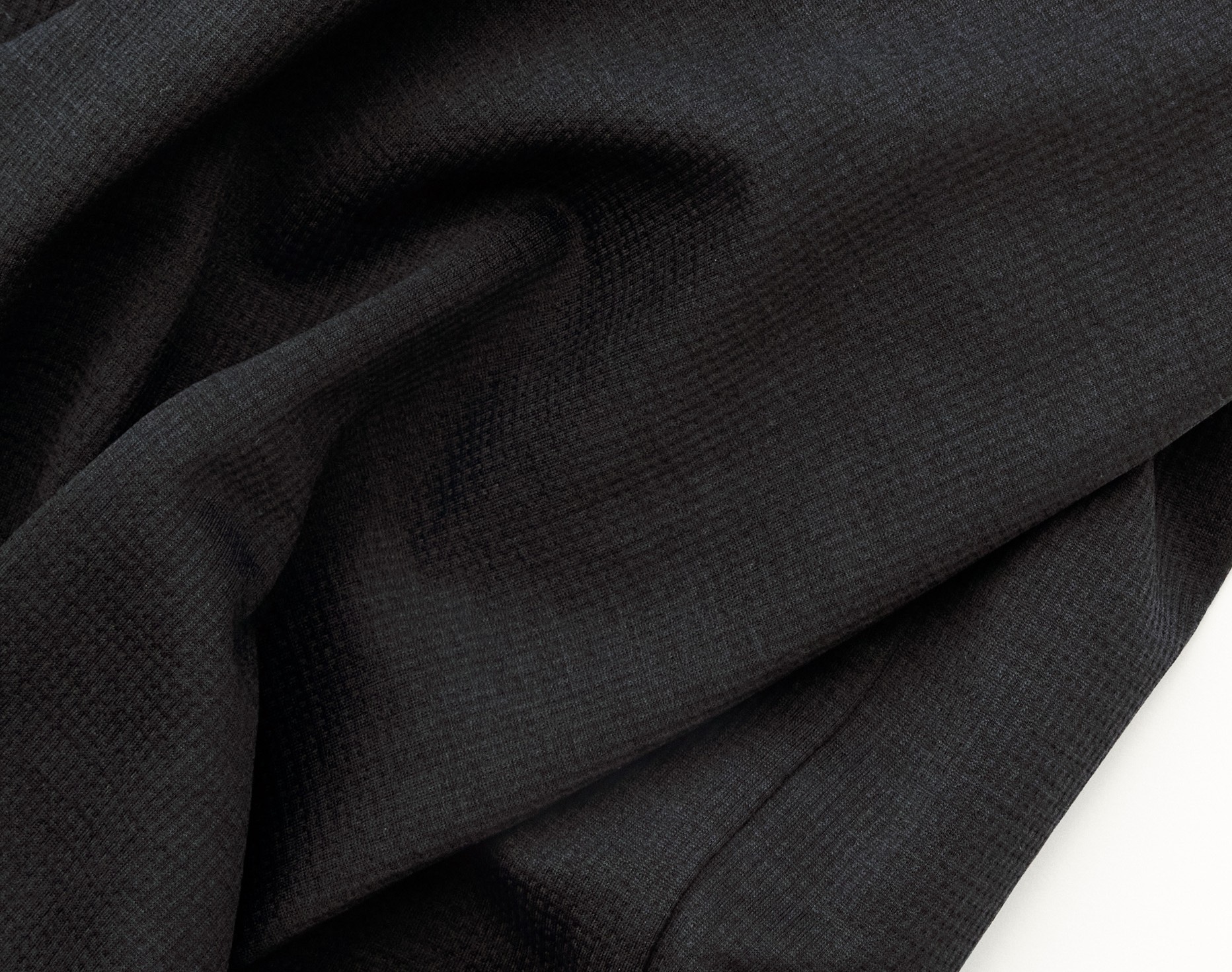 Black Balance singlet, detail view with small grey logo dot