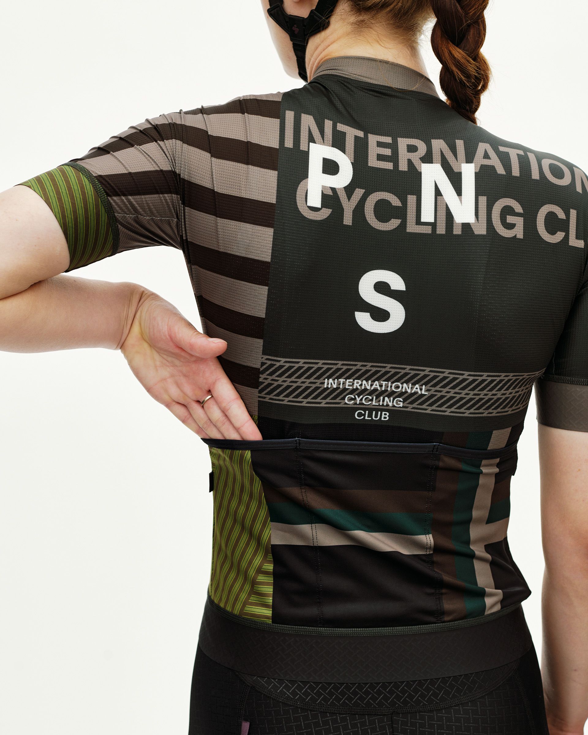 International Earth Mechanism women's cycling jersey, rear view on model with multicolor stripe print and back pocket