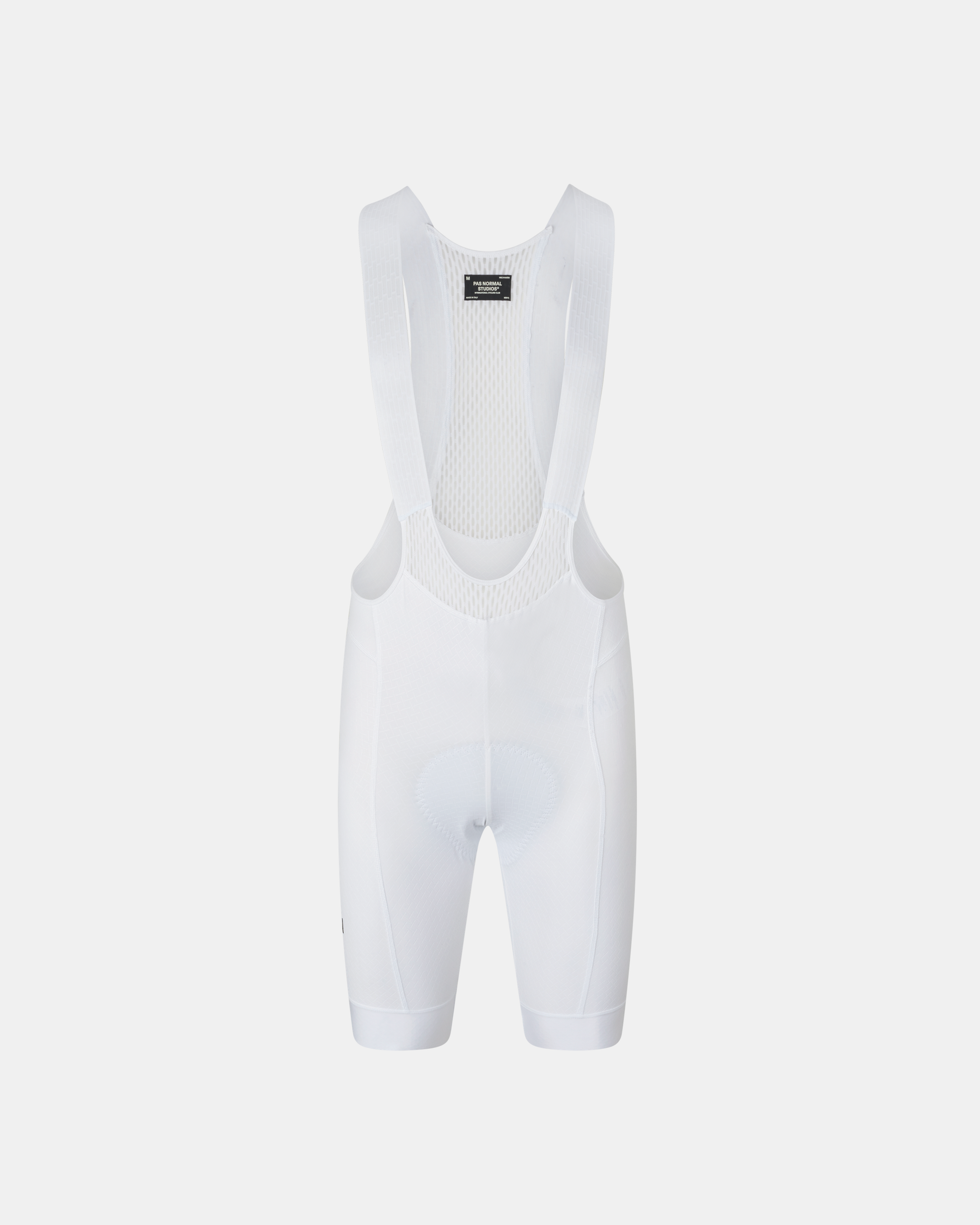 White Mechanism cycling bibs, front flat lay with mesh bib straps