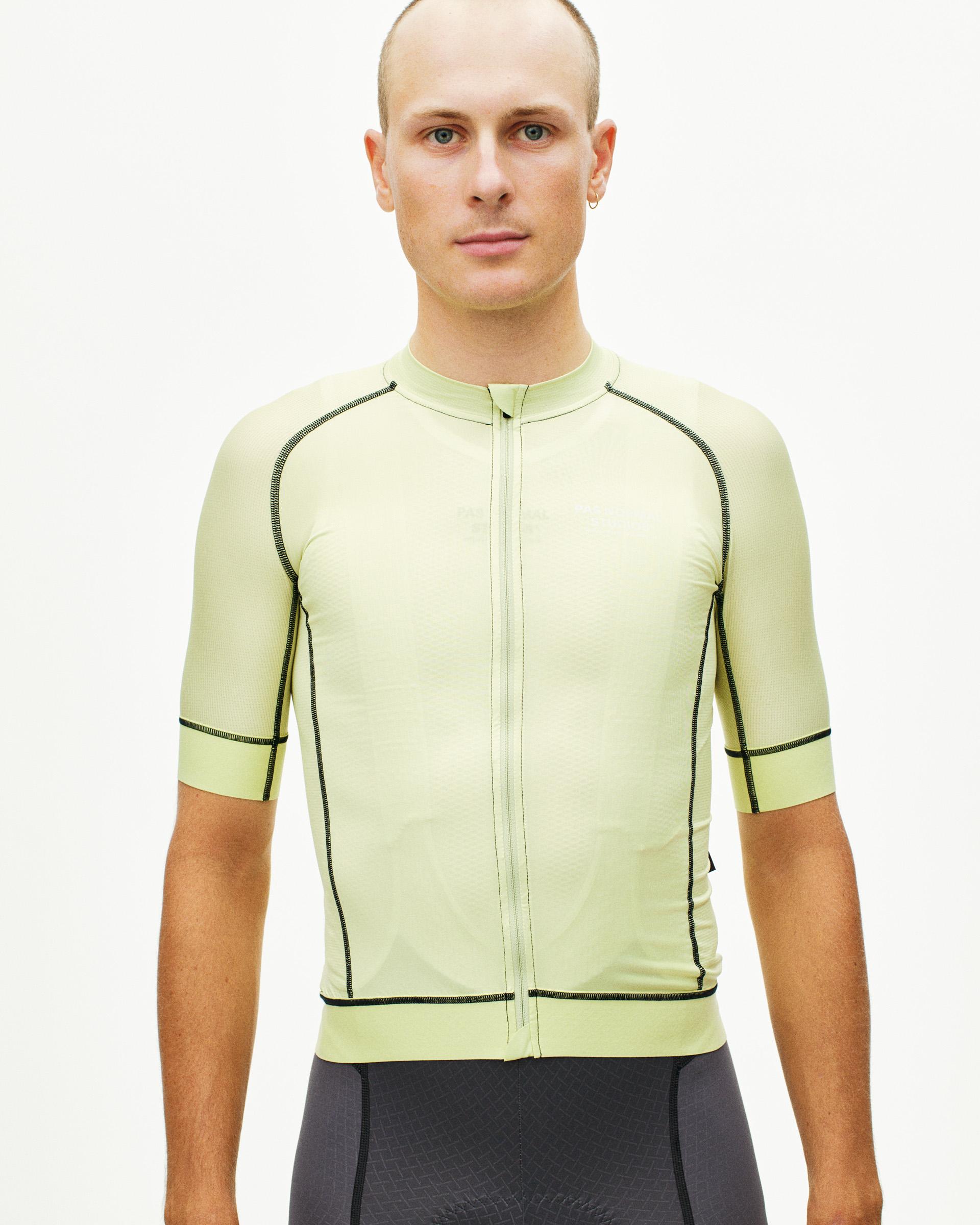 Green Mechanism cycling jersey on model, front view with contrast stitching